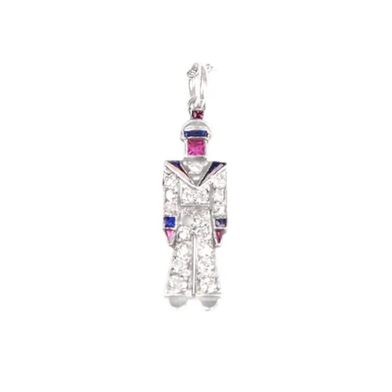 An exquisite Art Deco charm necklace showcases a gem-set Sailor with diamonds prong-set, complemented by natural calibre-cut rubies and sapphires bezel-set. Crafted in platinum circa 1920, the charm exhibits meticulous detailing.

Material:
