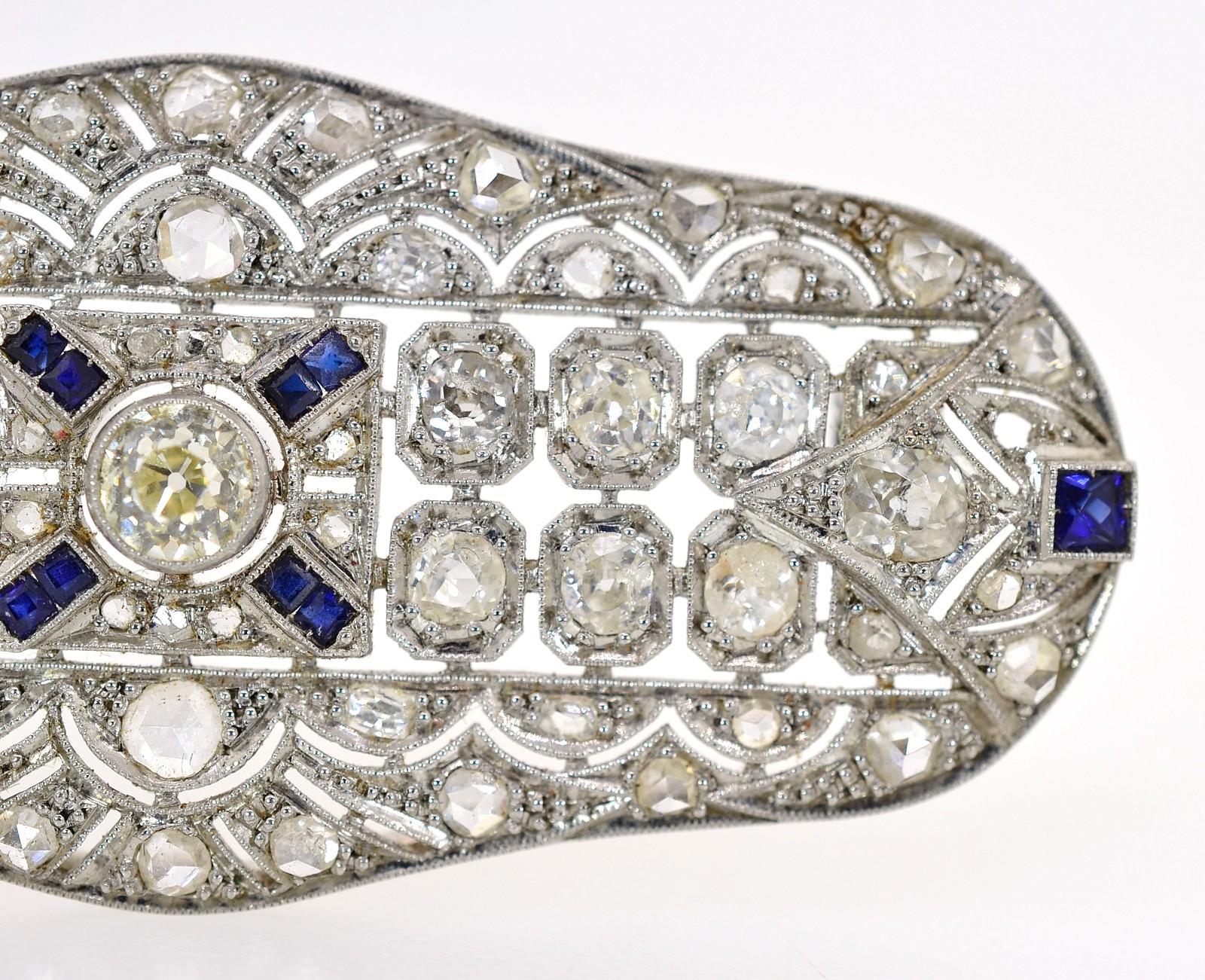 Created completely by hand during the 1920s is this lovely antique platinum brooch.  It centers an Old cut Diamond of approx. 0.50 carat, surrounded by Old cut and small Rose cut Diamonds.  All diamonds weigh a total of approx. 3.00 carat of H/I