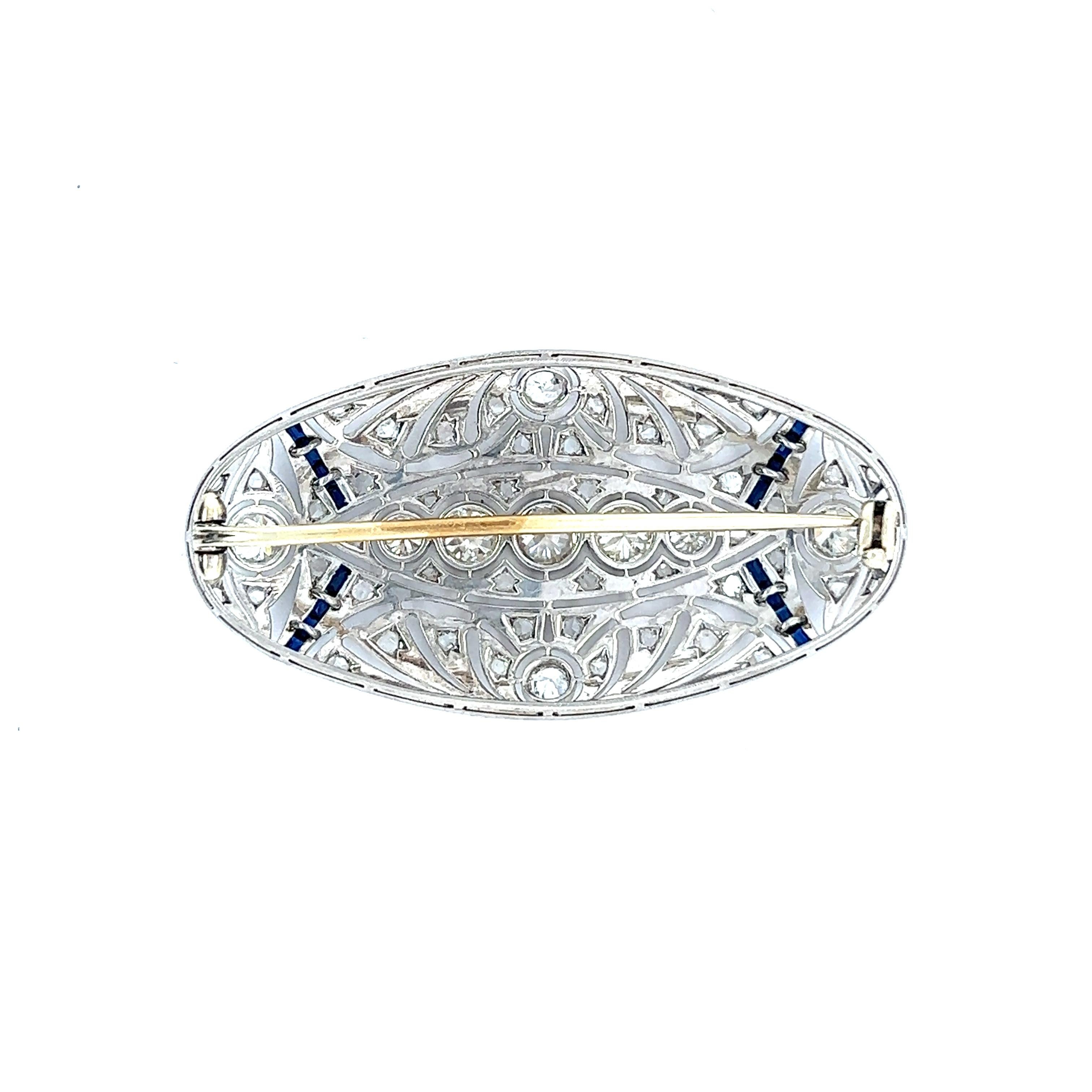 One Antique Old European Cut Diamonds Sapphire Platinum Brooch. Featuring nine old European cut diamonds with a total weight of approximately 1.75 carats, graded H in color, VS clarity. Accented by 48 rose cut diamonds with a total weight of