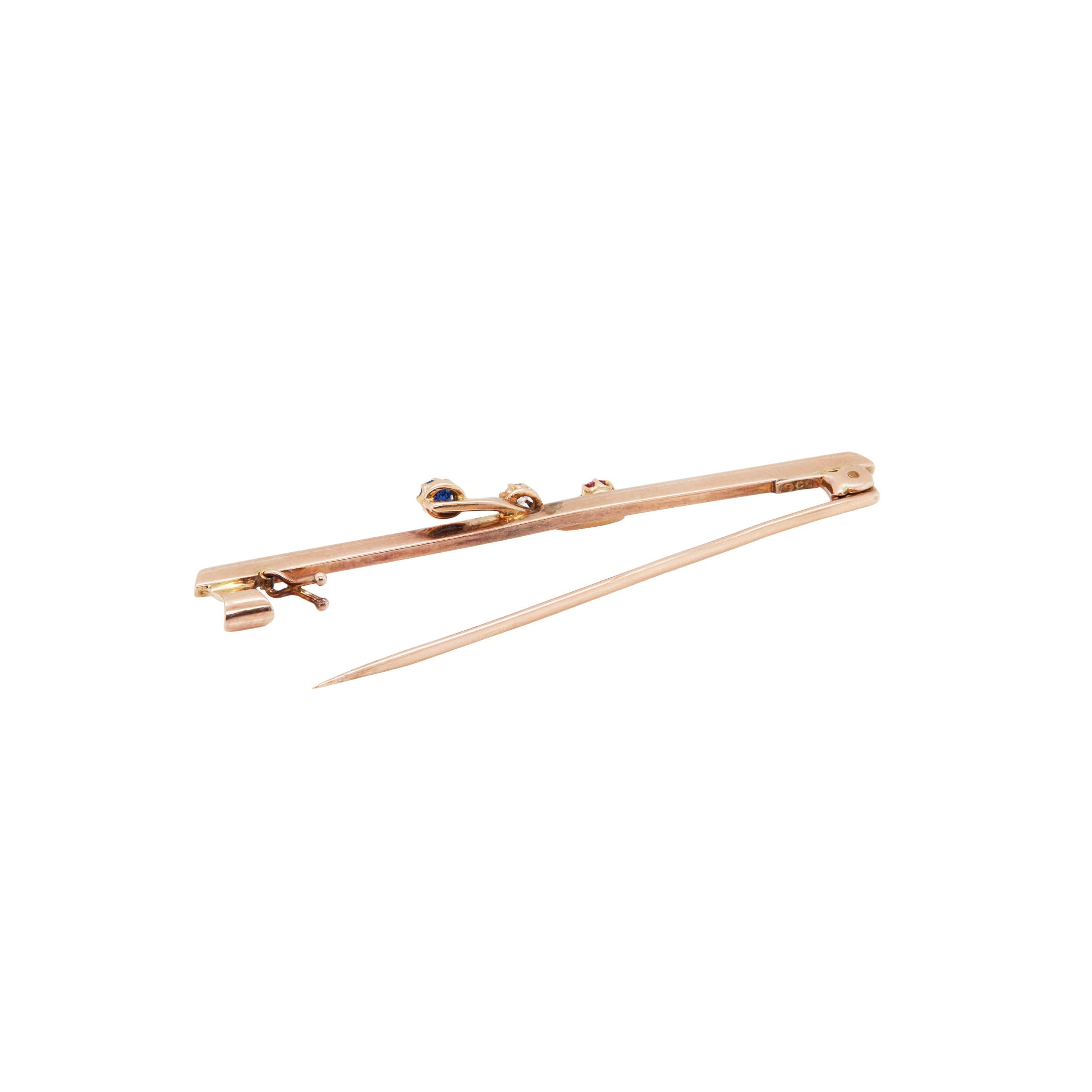 Delicate, but full of character and colour, this wonderful antique bar brooch is definitely a must have to any jewellery lover.

Masterfully crafted in 9 carat rose gold, the slender bar design is elegantly adorned with a trio of beautiful gemstones