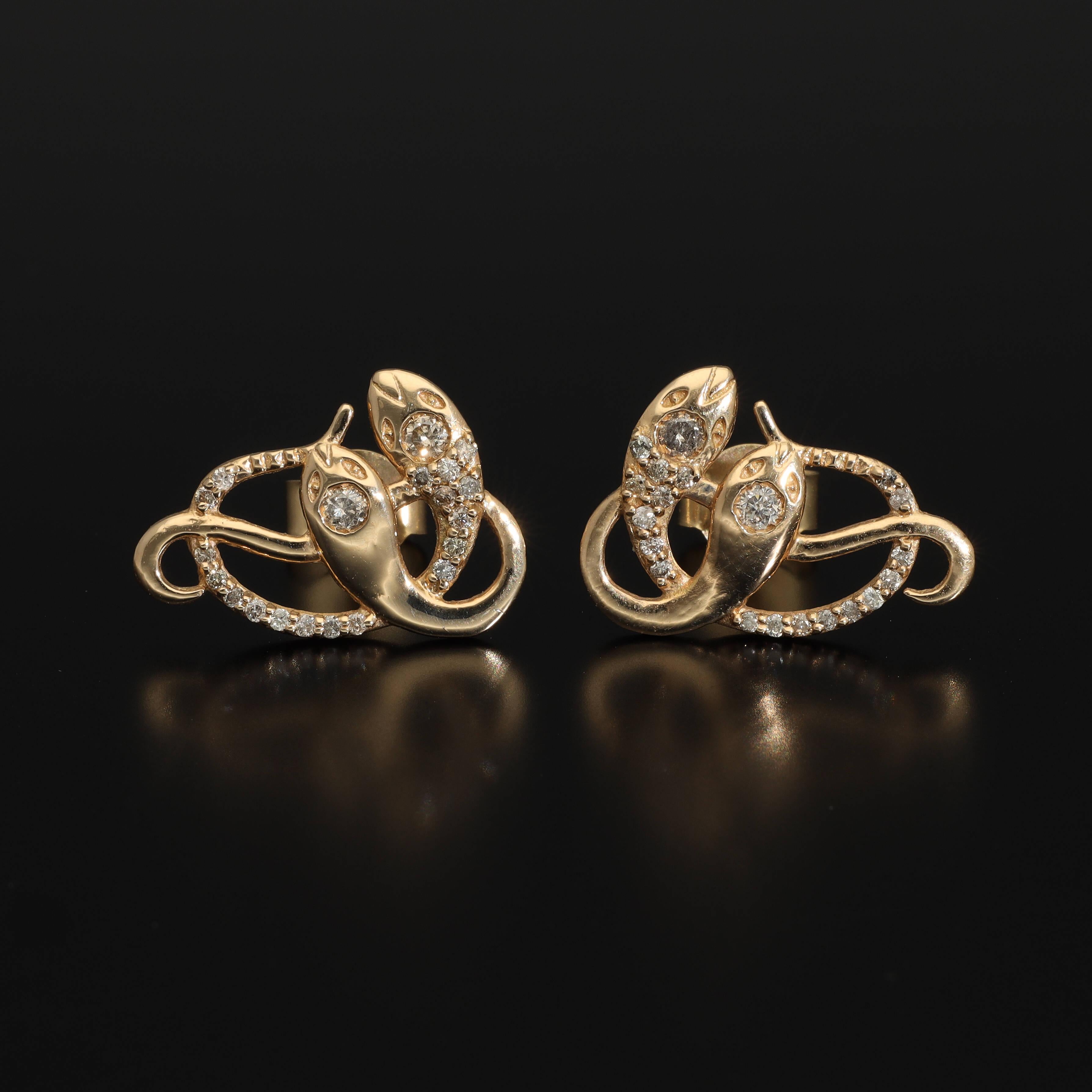 An artisan antique revival pair of solid 14ct gold snake stud earrings. These snake earrings are made of pure 14 carat gold and are set with natural diamonds. We have them both in white, rose and yellow gold, so please choose your preferred metal in