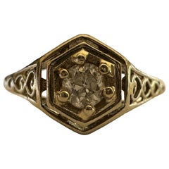 Anillo de compromiso antiguo con diamante solitario y filigrana