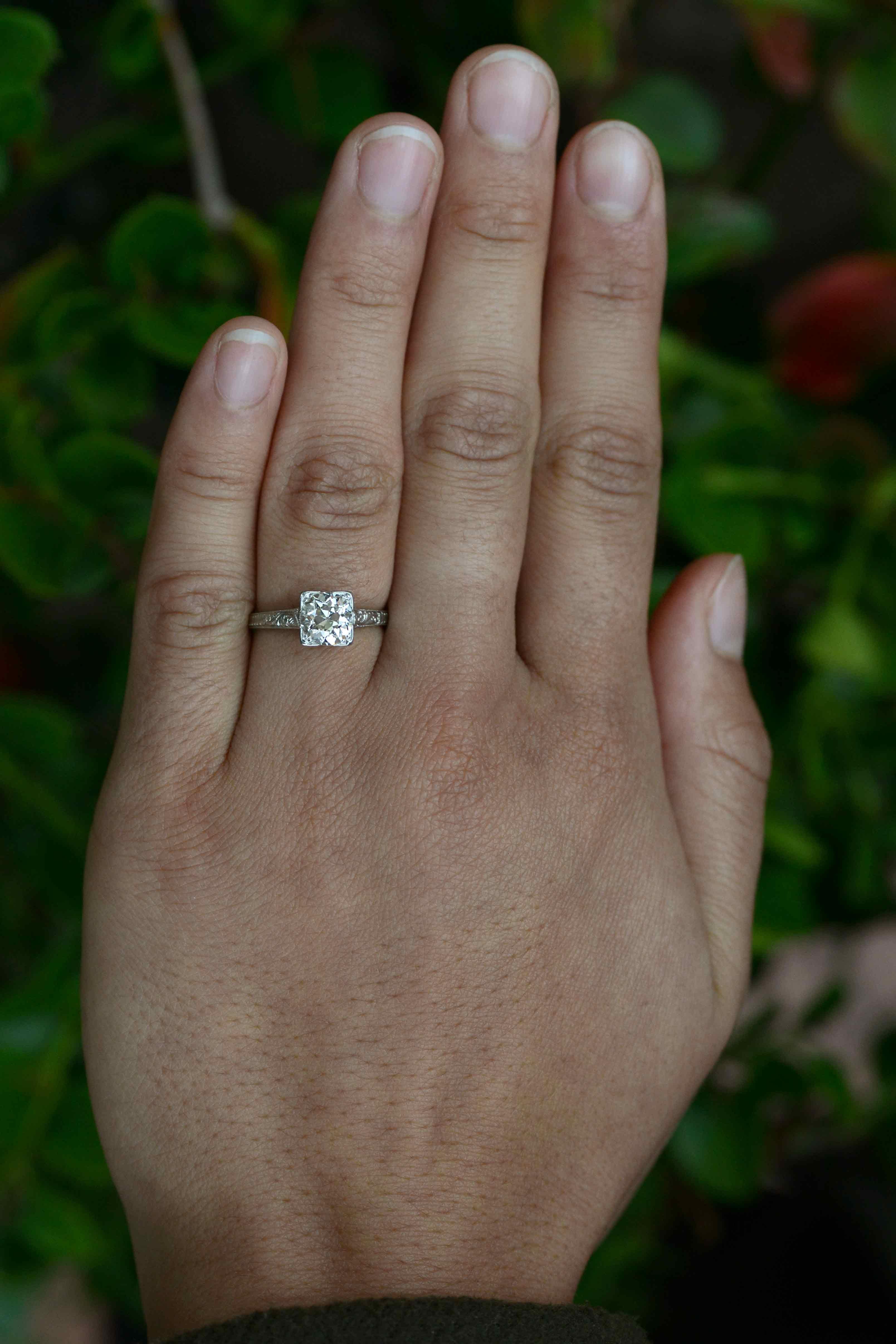 A timeless classic antique diamond solitaire engagement ring. The old mine cut diamond sparkles like a captivating prism with those chunky facets that explode brilliant light in every direction. Boasting a weight of 1.27 ct, and of a near colorless