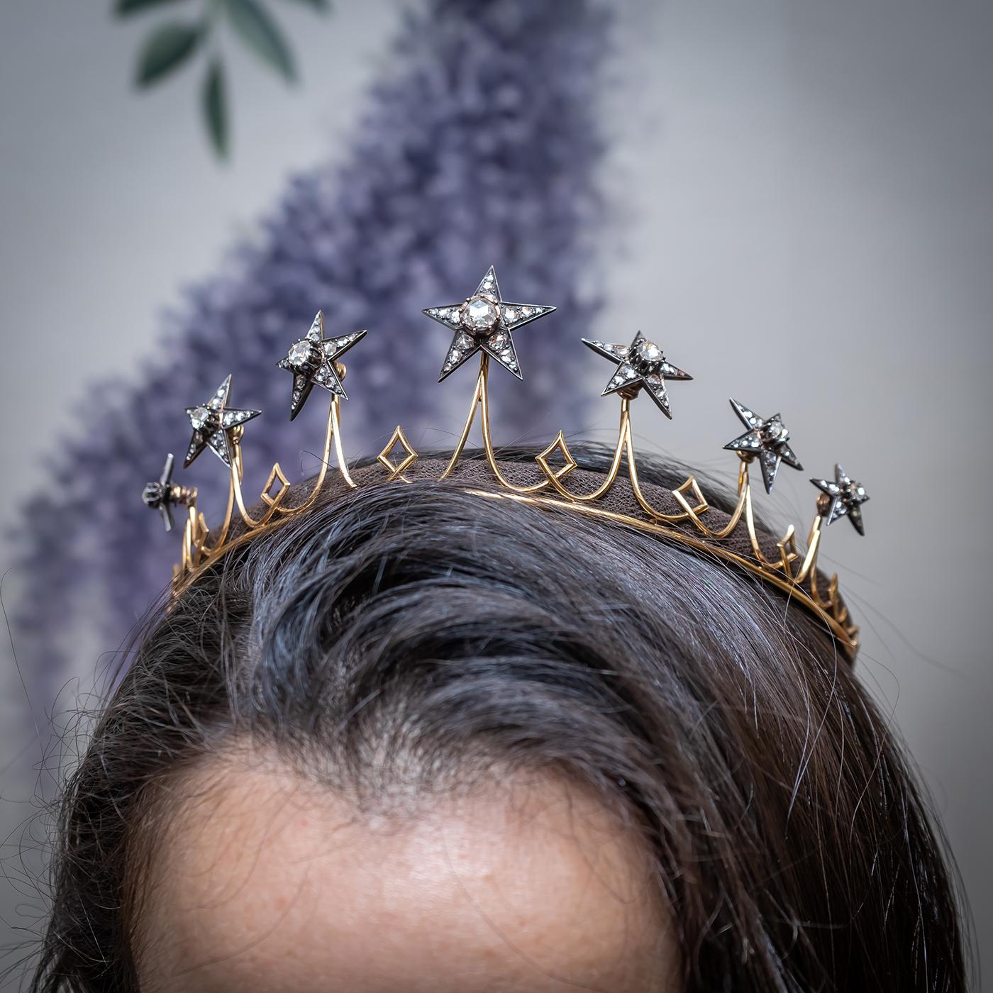 A mid-Victorian diamond tiara, comprising seven, rose-cut diamond set, en tremblant stars, mounted in silver-upon-gold, set with approximately 8.00ct of diamonds, on a gold frame. The stars are detachable and could be used for hair pins, or