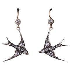 Boucles d
oreilles hirondelle en or 14k et argent, avec diamants anciens
