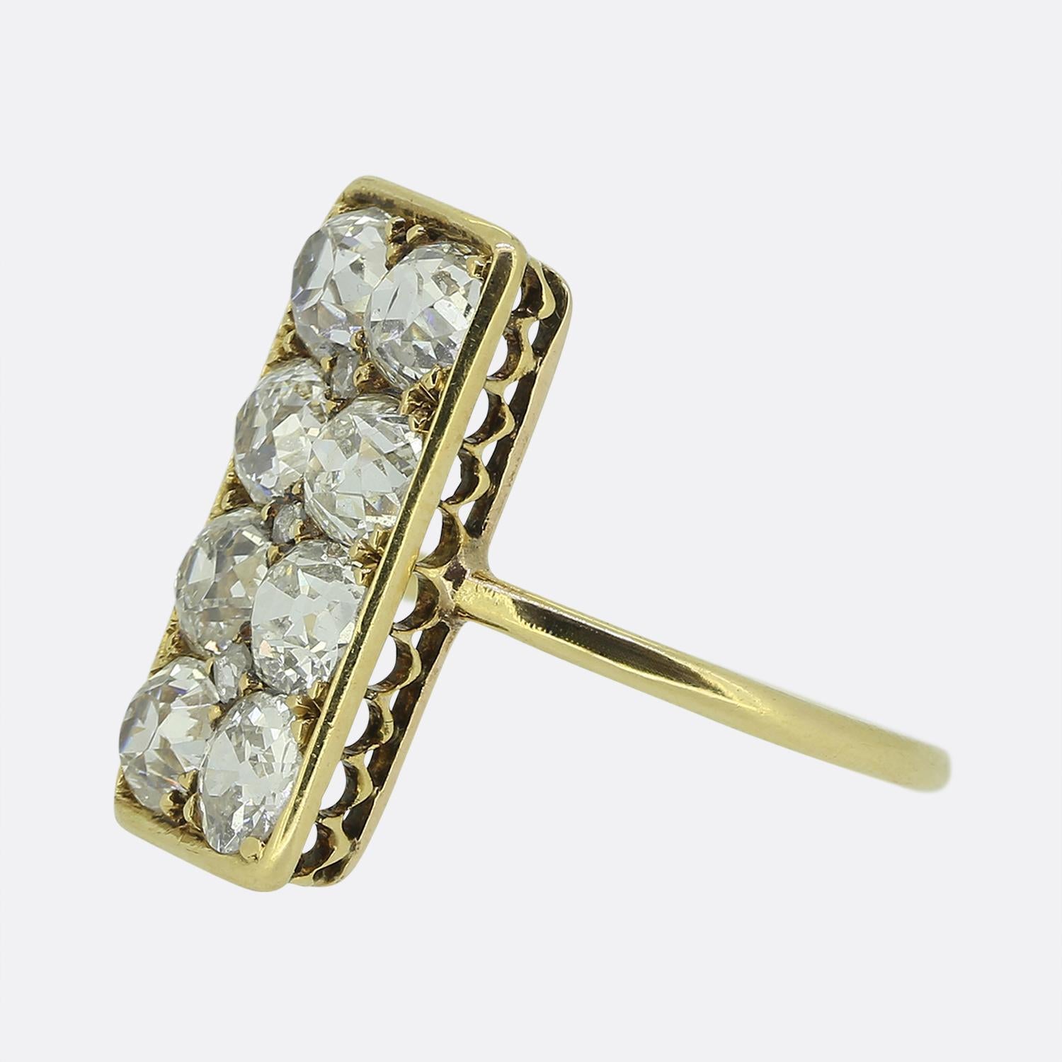 Here we have a striking cluster ring originally dating back to the Victorian era. This piece has been crafted from 18ct yellow gold and features eight round faceted old mine cut diamonds. The stones are set in pairs amidst a rectangular face,