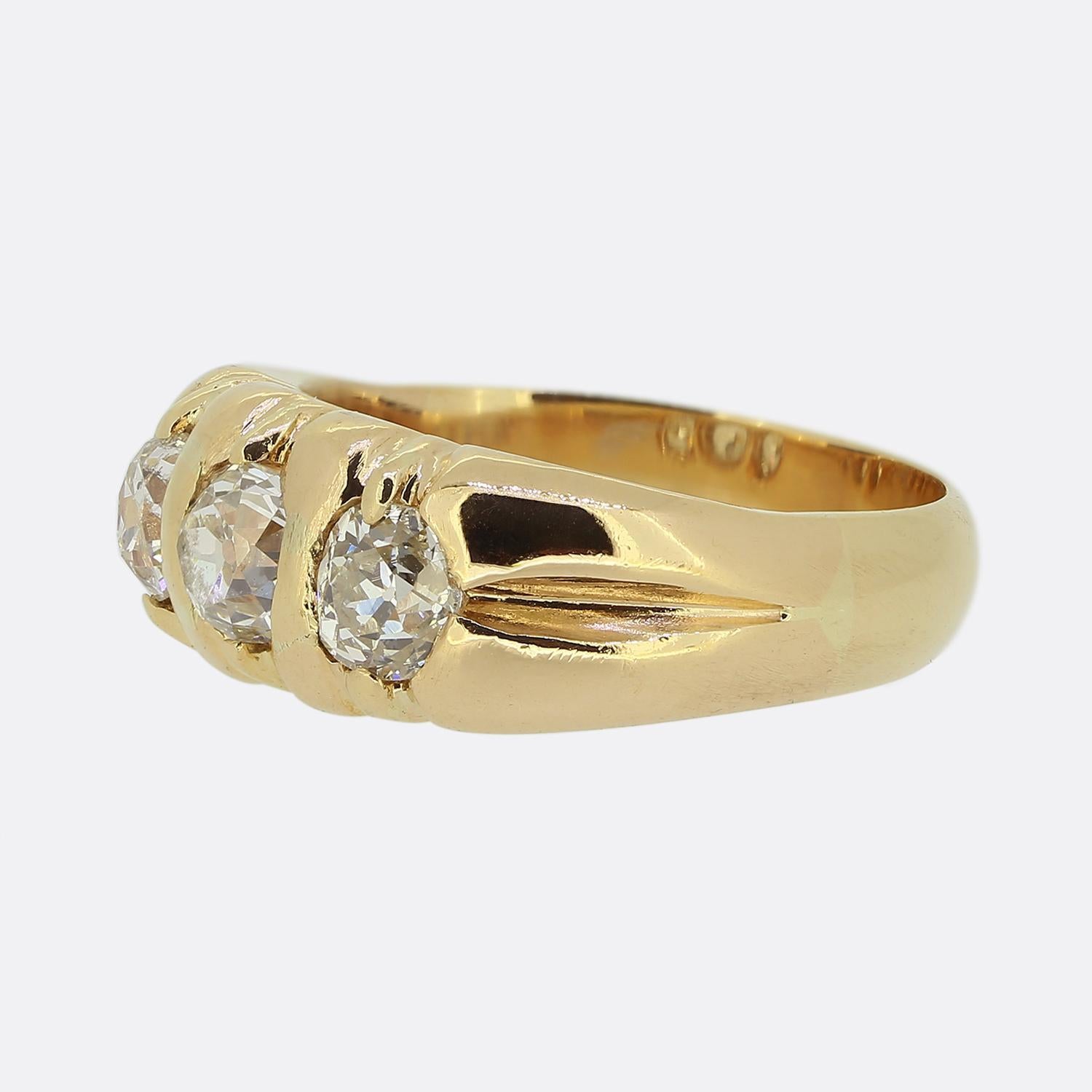 Here we have a chic and stylish antique ring featuring a trio round faceted old mine cut diamonds. These diamonds have been individually claw set in a band of 18ct gold, showcasing a warm rose gold hue. The design is bold, with each diamond securely