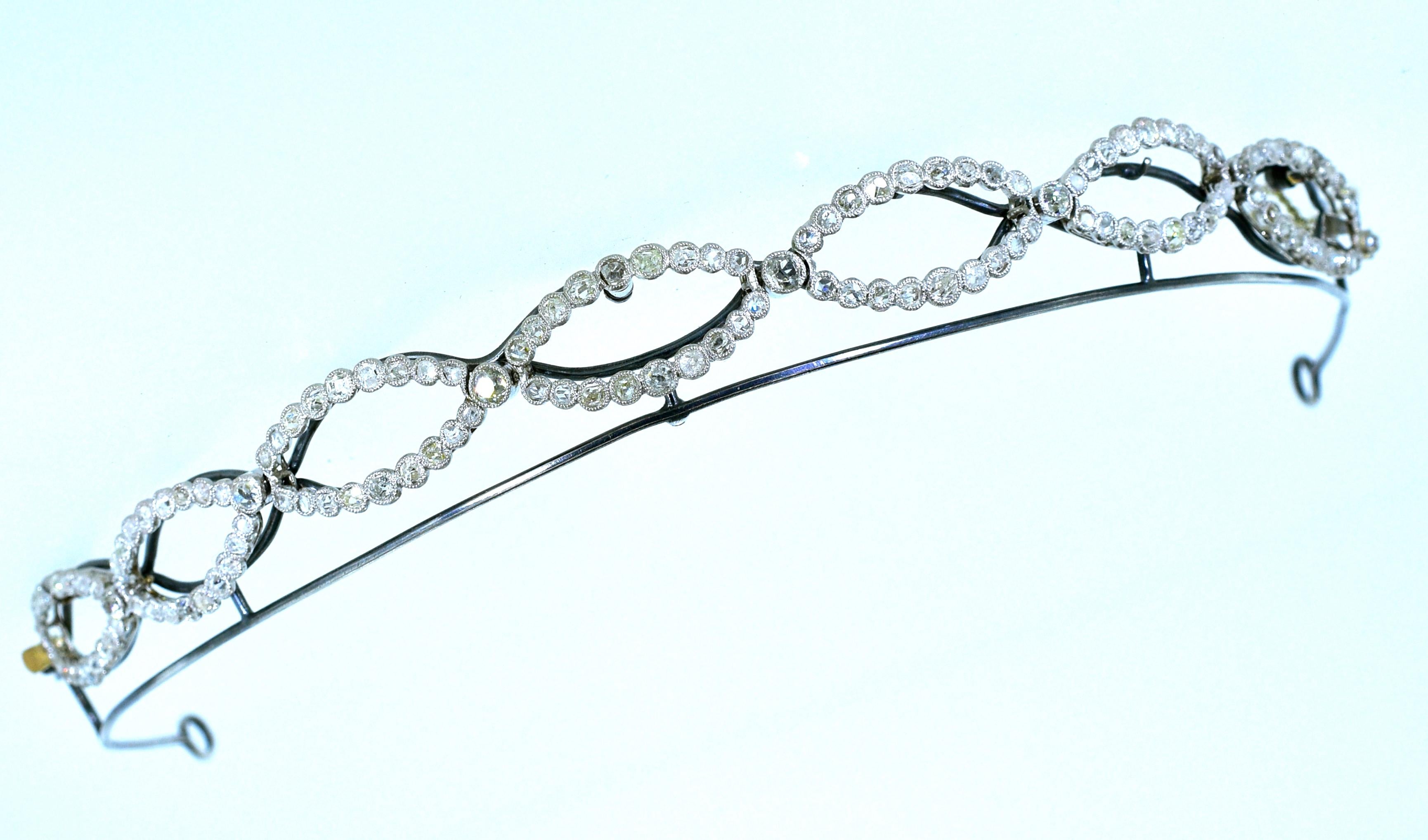 Platinum and diamond tiara/bracelet, circa 1890, this piece has both European cut diamonds and rose cut diamonds with approximately 5 cts.  One can easily remove the frame and wear the platinum piece as a bracelet.  