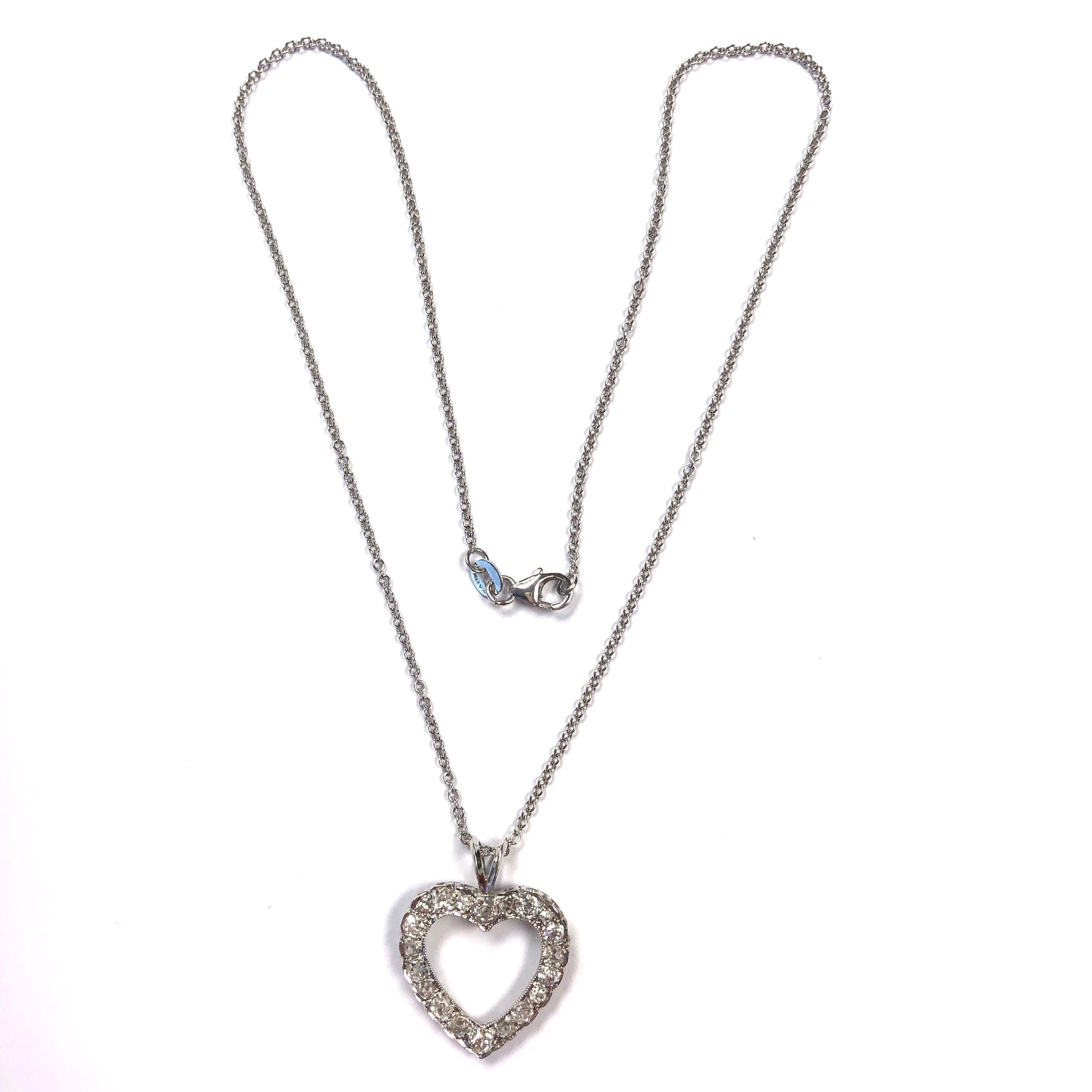 The pendant is crafted in 14K white gold and set with twenty old european and rose cut diamonds, supported by a sixteen inch rolo chain with lobster claw clasp. Approximate total diamond weight: 1.60ct. Clarity: SI1-I1, Color:
