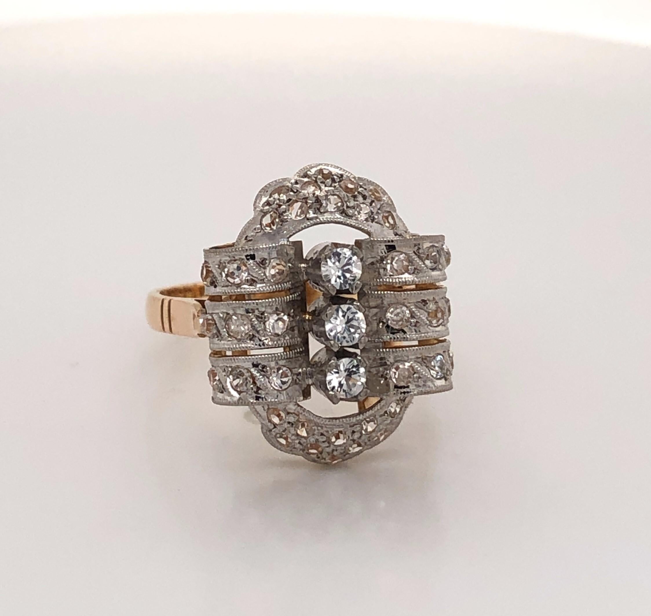 Elegant 1920's antique ladies ring with over small forty diamonds at just under half carat total weight.  The ring features three prong-set center  diamonds that are vertically mounted in white gold and framed by an intricate diamond covered oval