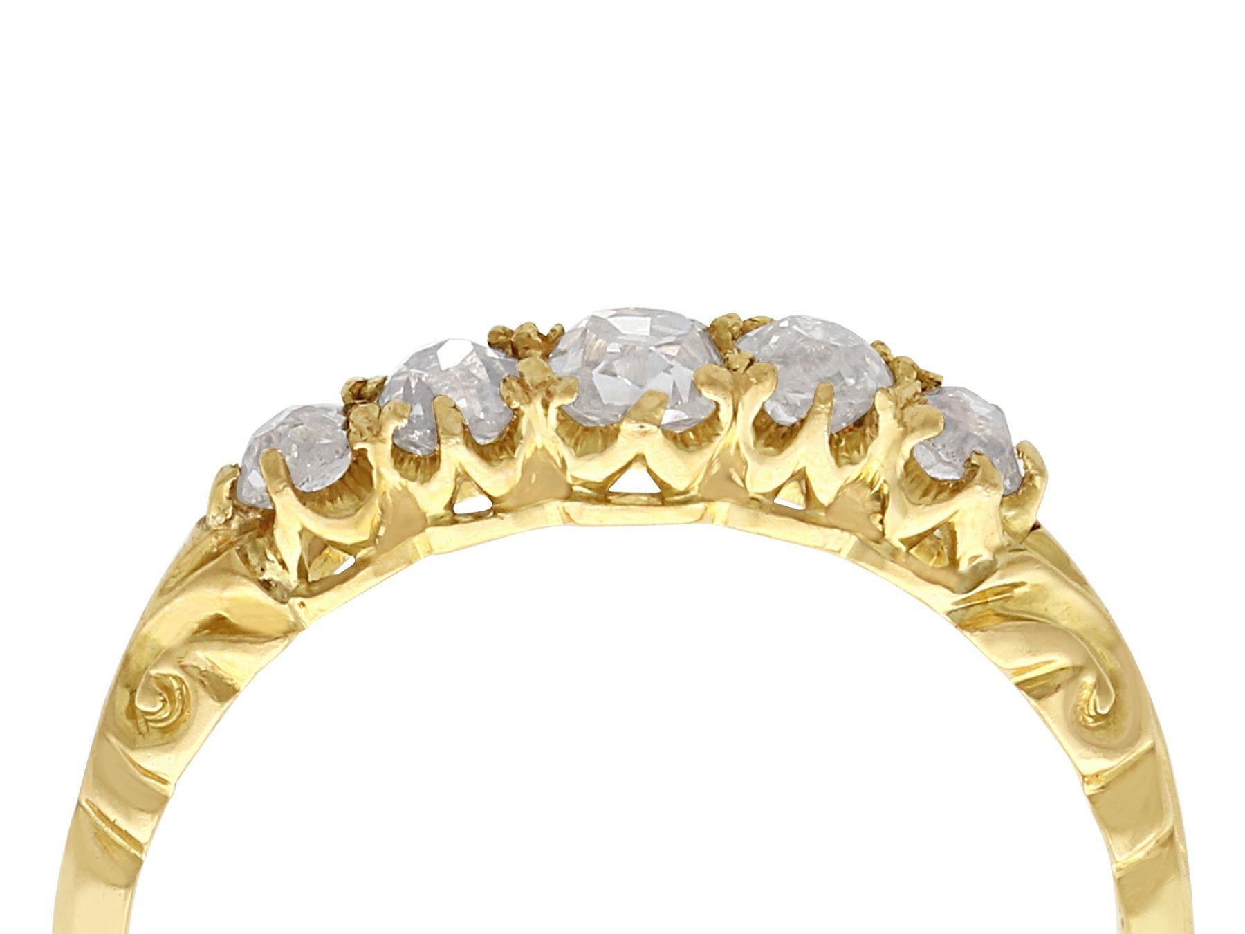 A fine and impressive antique 0.66 carat diamond and 18 karat yellow gold five stone ring; part of our diverse antique jewelry and estate jewelry collections.

This fine and impressive antique five stone diamond ring has been crafted in 18k yellow
