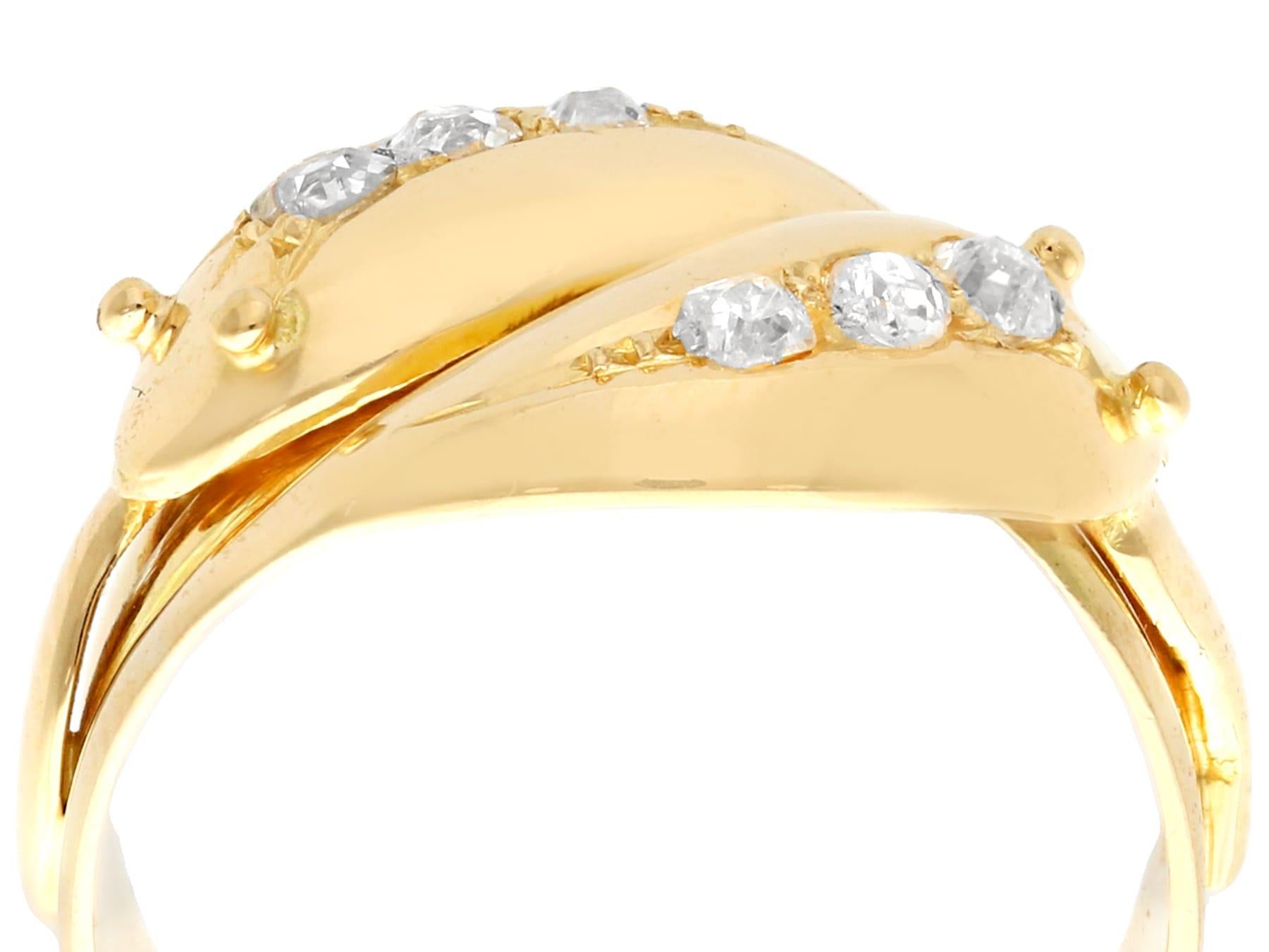 A fine and impressive, unusual antique George V, English 0.54 carat diamond, 18k yellow gold snake ring; part of our diverse antique jewelry and estate jewelry collections.

This antique George V dress ring has been crafted in 18k yellow gold.

This