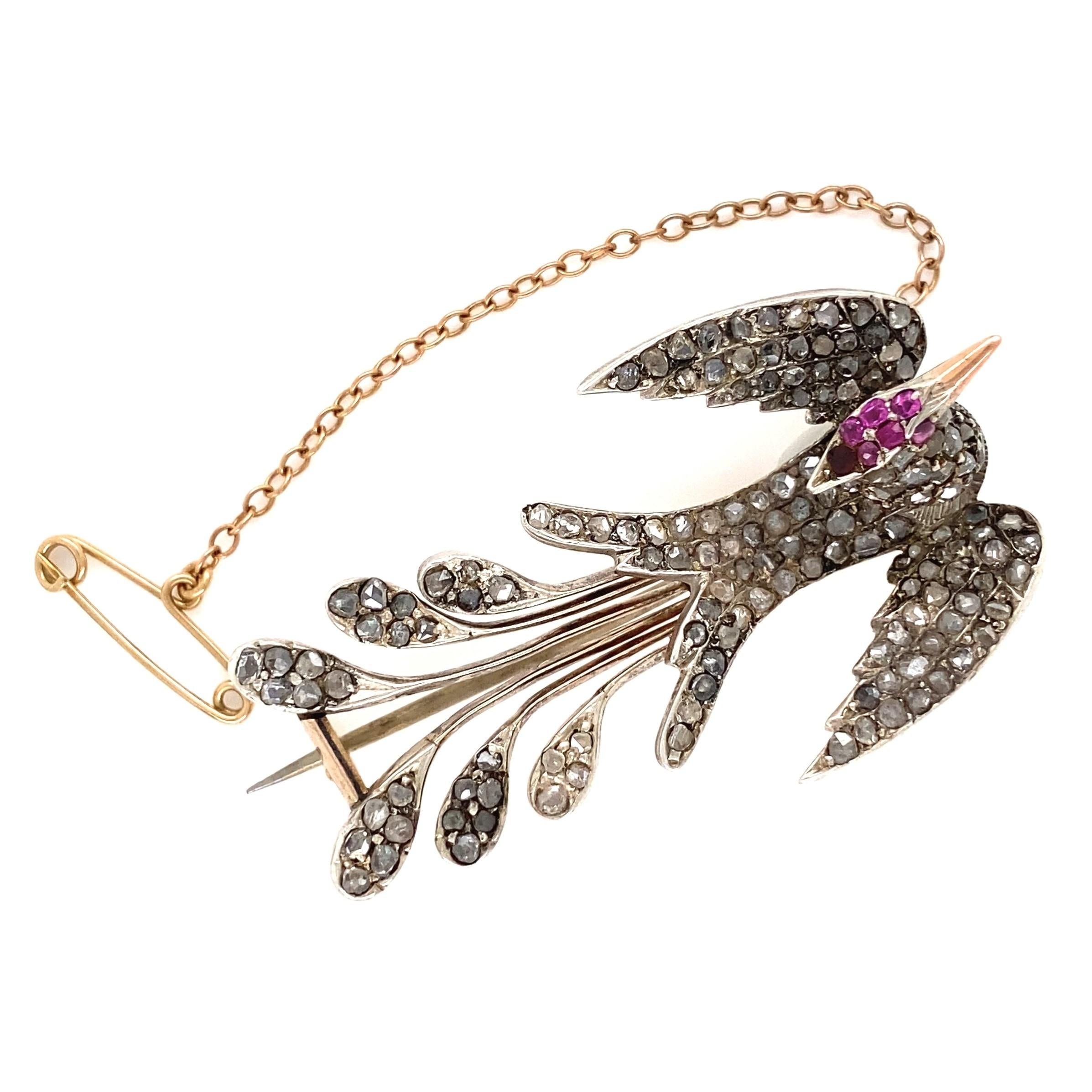 Fabulous Victorian Antique Diamond and Ruby Bird Brooch Pin. Hand set with 175 Rose Cut Diamonds approx. 1.40tcw and 7 Natural Rubies approx. 0.10tcw. Hand crafted 18K Yellow Gold mounting. Bird measures approx. 1.82