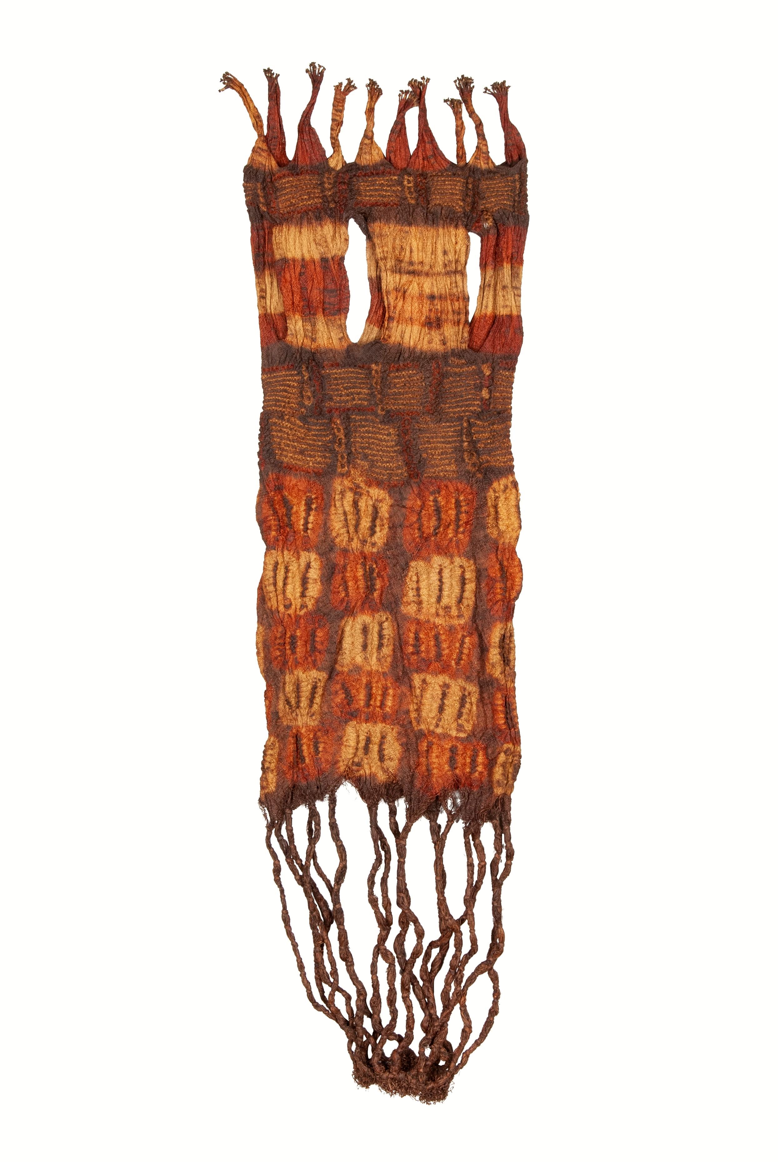 Antique Dida Woman’s Plaited Loin Cloth, Ivory Coast

This unusual textile is made from hand-plaited raffia fiber that is then tie or stitch-resist dyed with natural pigments, creating a richly textured surface. The tubular structure of this loin