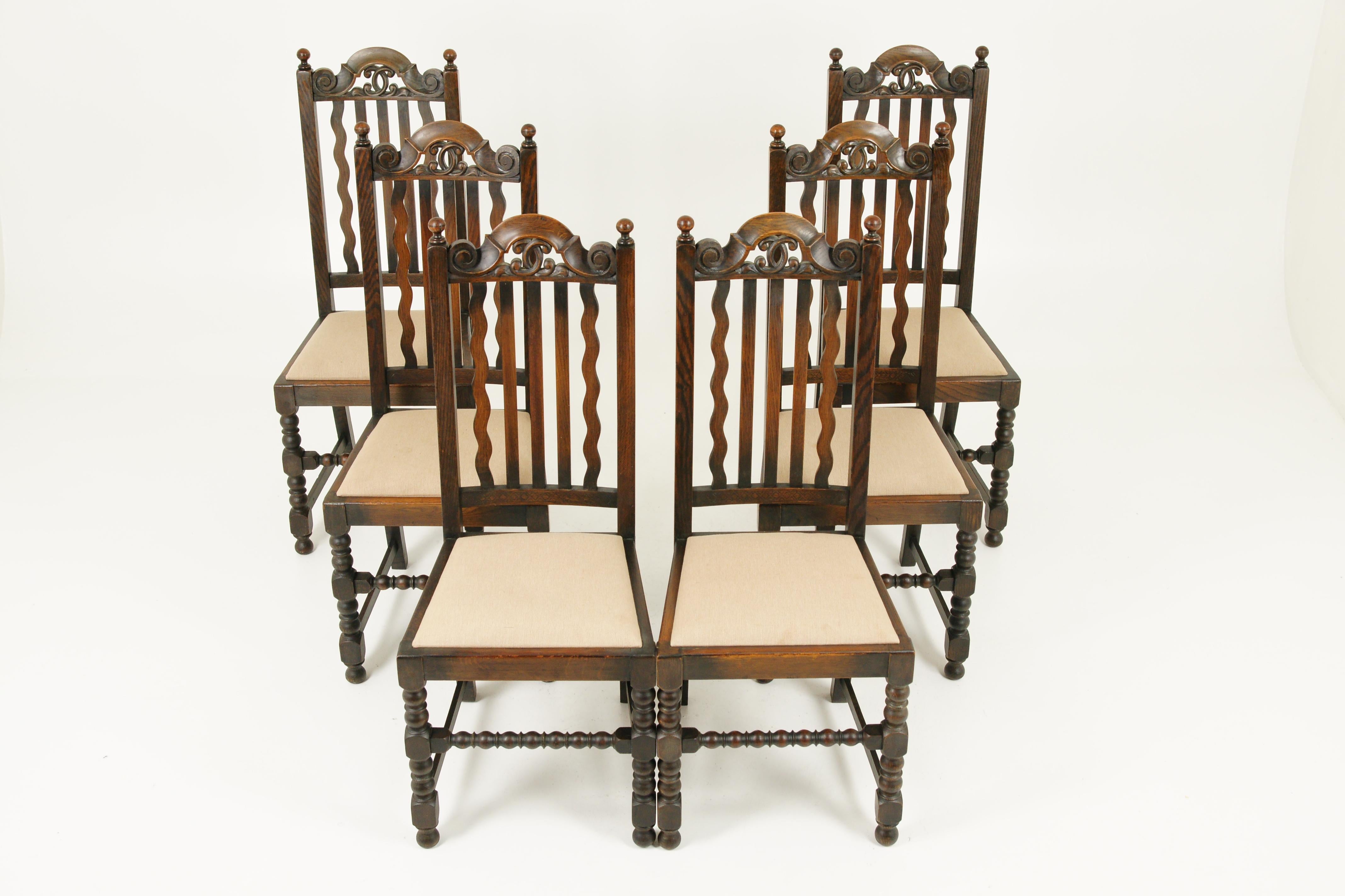 Antique dining chairs, 6 oak dining chairs, Scotland 1920, Antique Furniture, B1726

Scotland, 1920
solid oak with original finish
high back with open carved top
finials to tops of supports
three straight slats and two wavy slats on the
