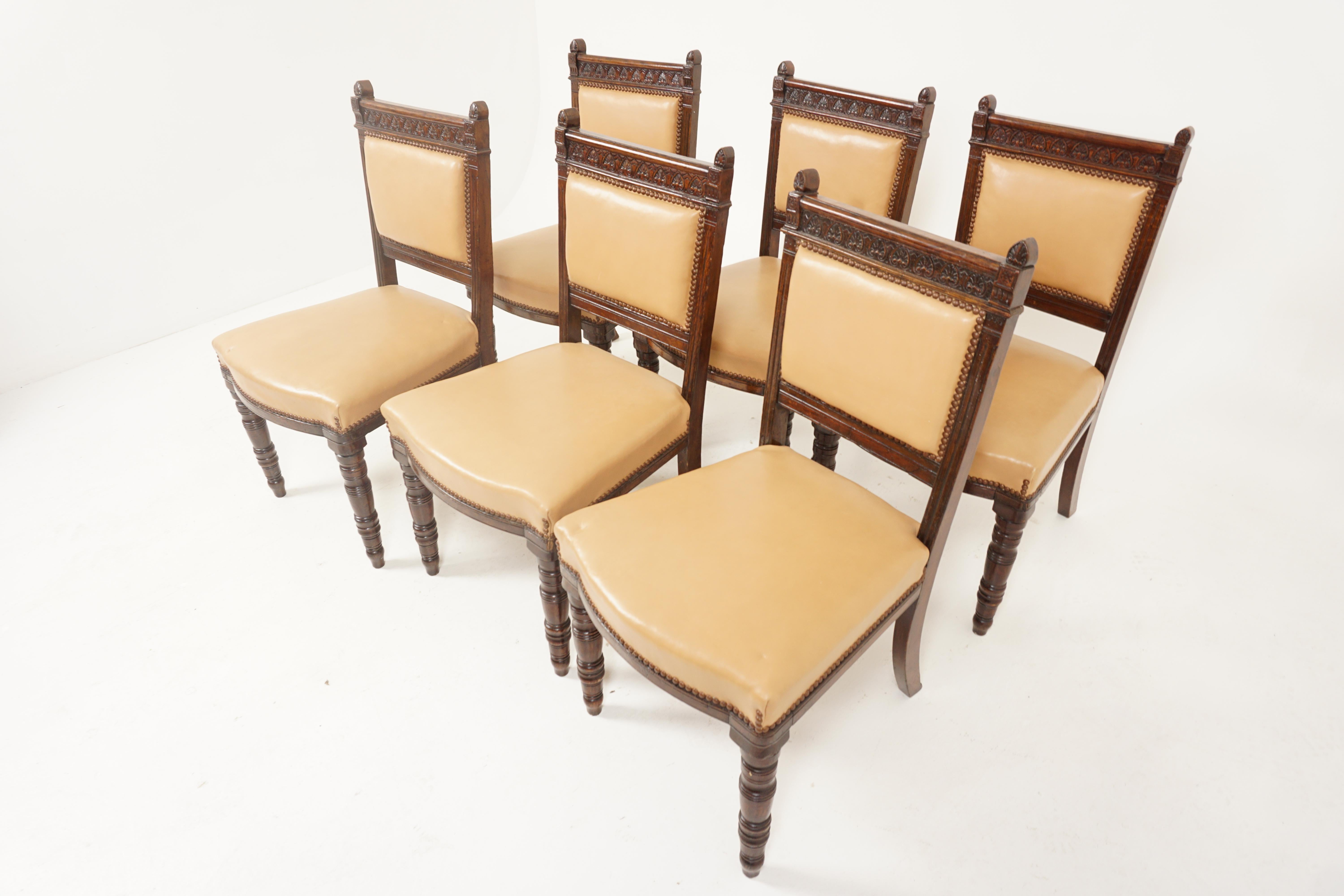 Antique dining chairs, set of 6, oak, Scotland 1895, B2664

Scotland 1895
Solid oak
Original finish
Carved top rail flanked by upright supports
Upholstered padded back
Large stuff over seat with brass studding
Turned carved front legs and