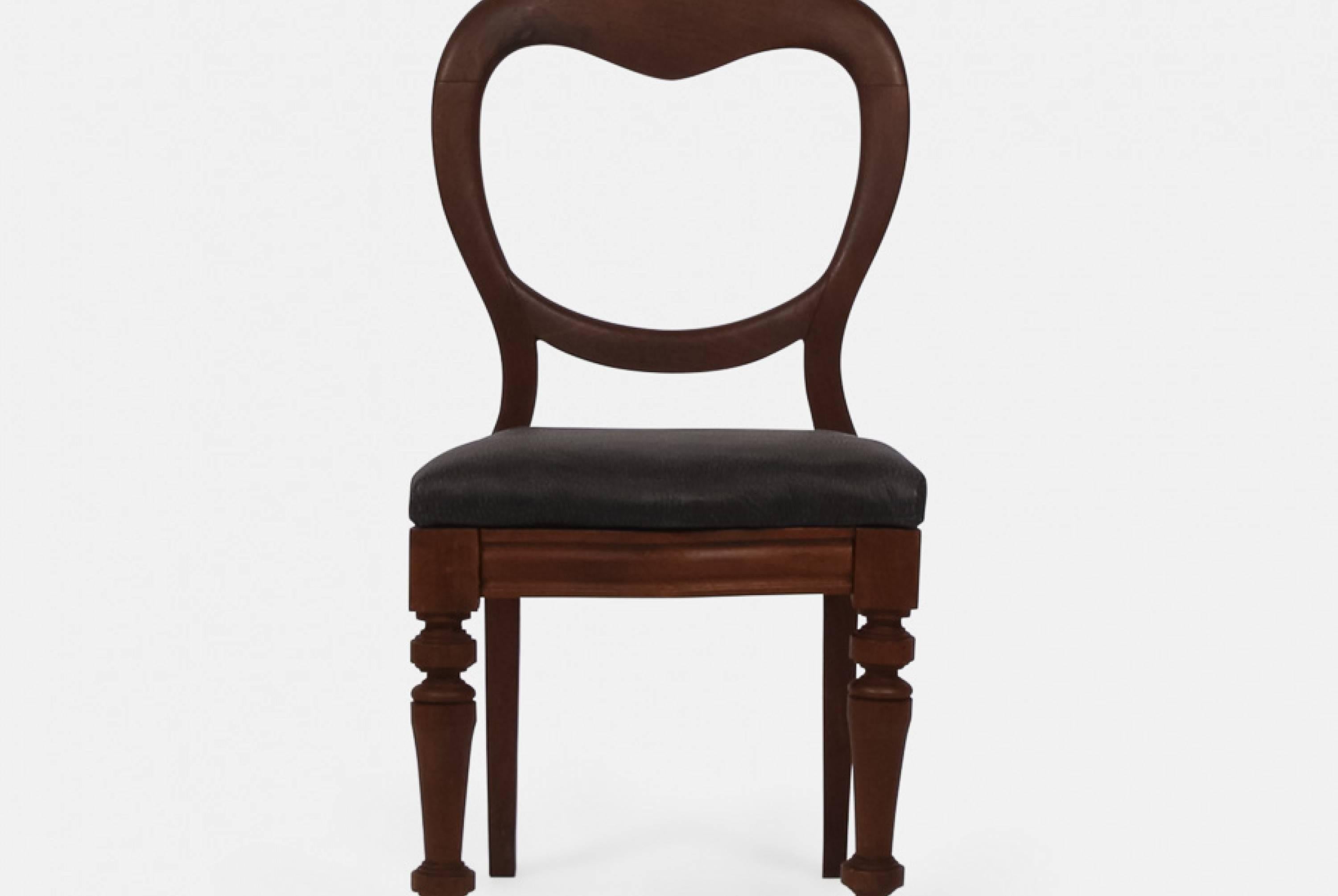 A set of six antique mahogany balloons back dining chairs with black leather seats.
The seat pads have been newly recovered in Andrew Martin black leather.
