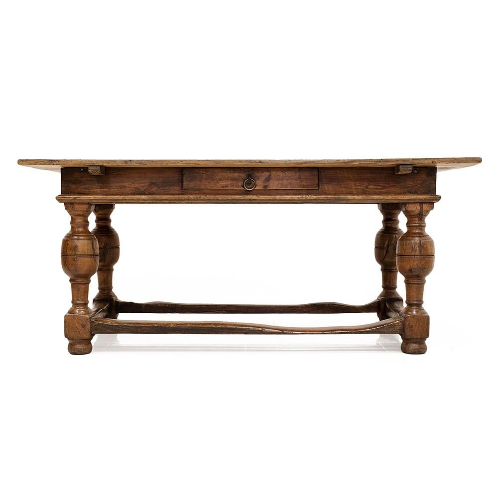 This gorgeous antique table was probably made circa 1770-1800. The tabletop is made of pine wood and base is made of ash and pine wood. One drawer resides in the table’s apron that allows for storage. Five-wide pine boards comprise the table’s top.