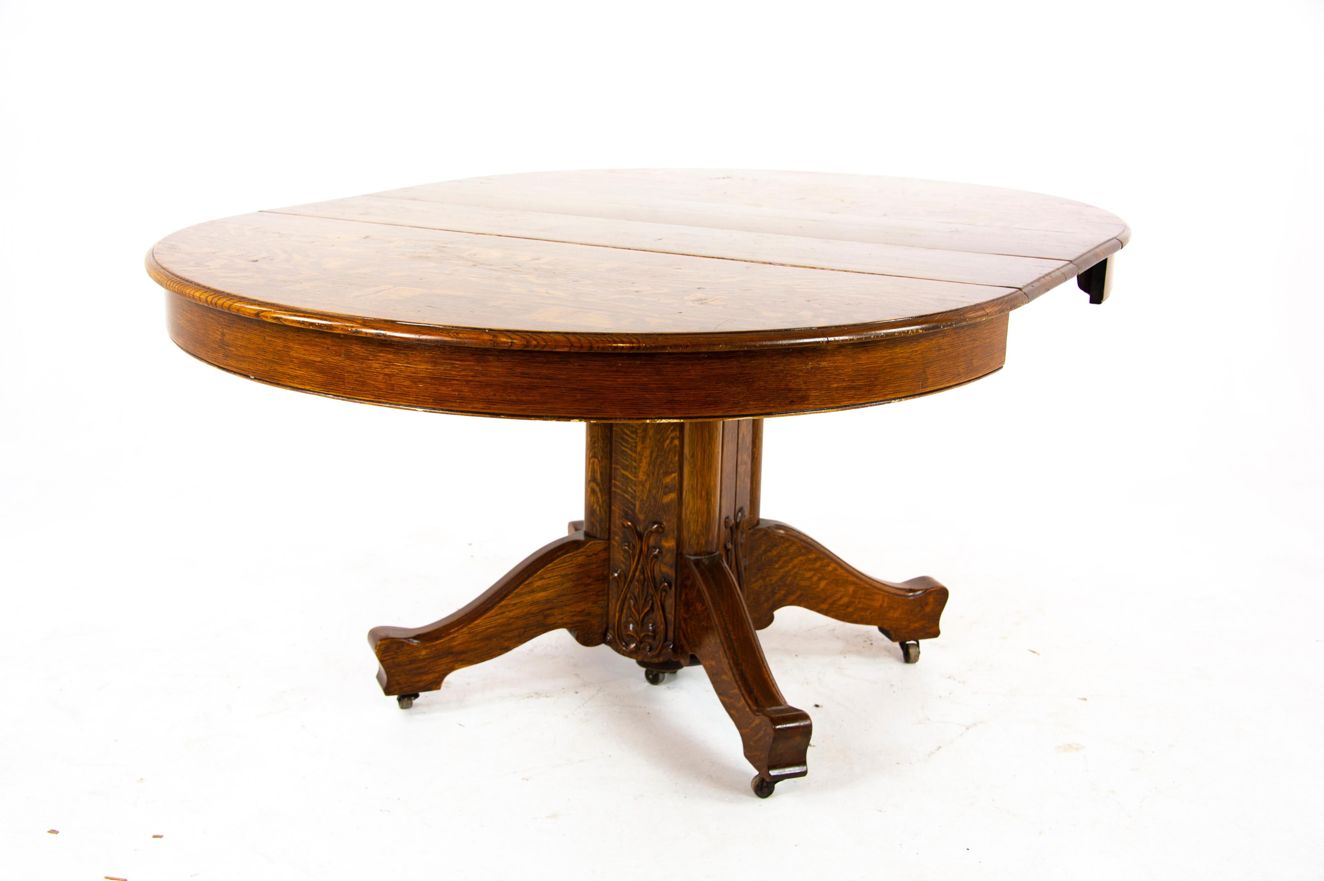 Antique dining table, pedestal table, vintage oak table, America, 1910, Antique Furniture, B1496

America, 1910
Tiger oak construction
Circular top with two original leaves
Sitting on a split pedestal base below
Original castors
Table extends