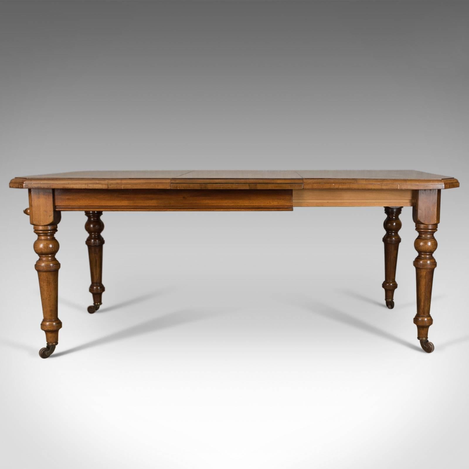 This is an antique dining table, a Scottish oak extending table by Matthew Lawson of Ayr, seating up to six comfortably and dating to circa 1900.

Beautifully crafted in select Scottish oak
Displaying grain interest and a desirable aged