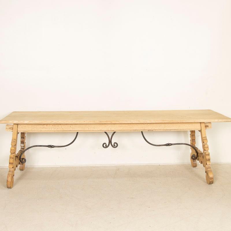 Spanish Antique Dining Table with Carved Legs and Scrolled Iron Base from Spain
