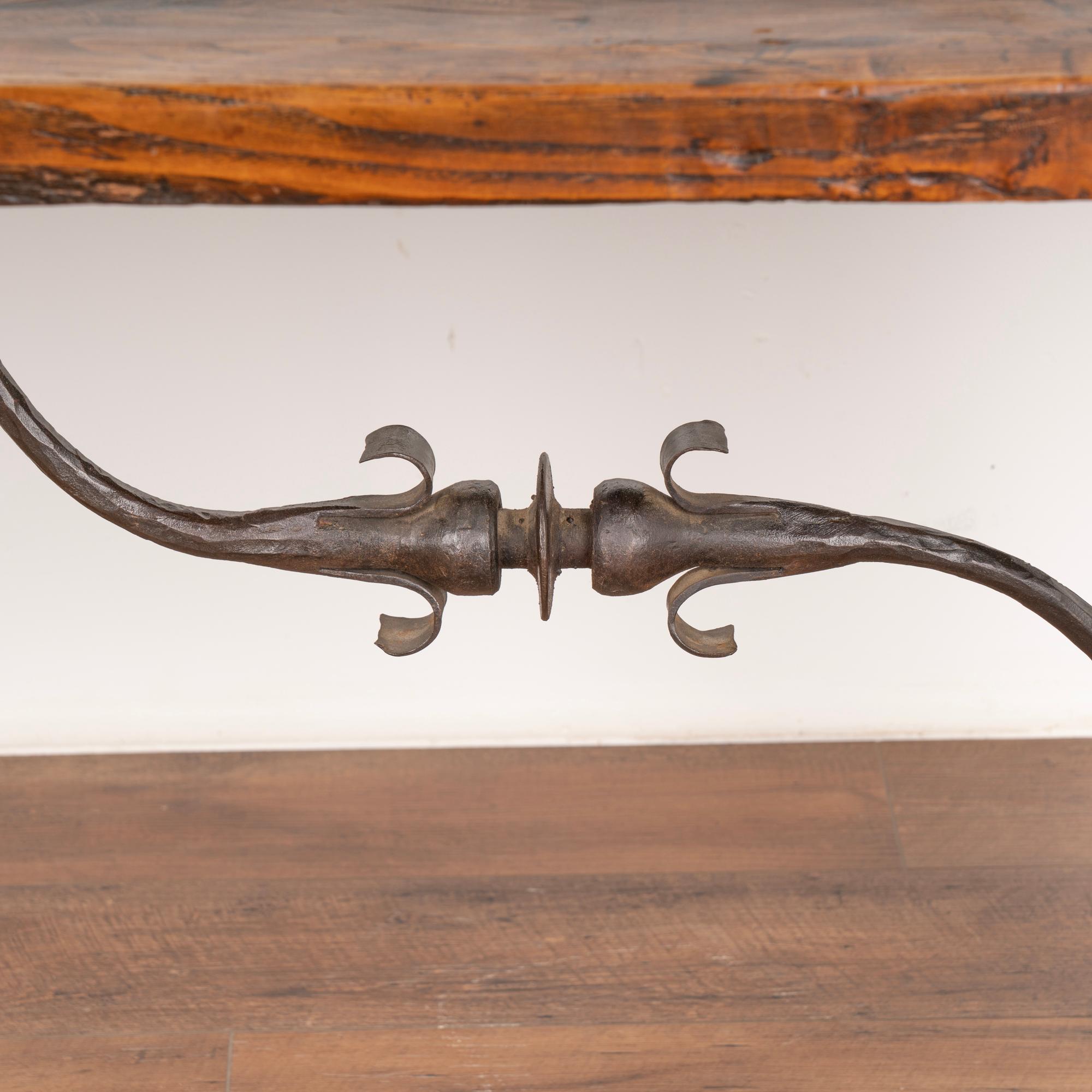 Spanish Colonial Antique Dining Table with Turned Legs and Scrolled Iron Stretcher from Spain