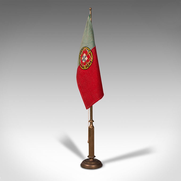 This is an antique diplomat's desk flag. A Continental, brass adjustable Portuguese flag on stand, dating to the early 20th century, circa 1920.

One for the patriotic or collector of international interest
Displays a desirable aged