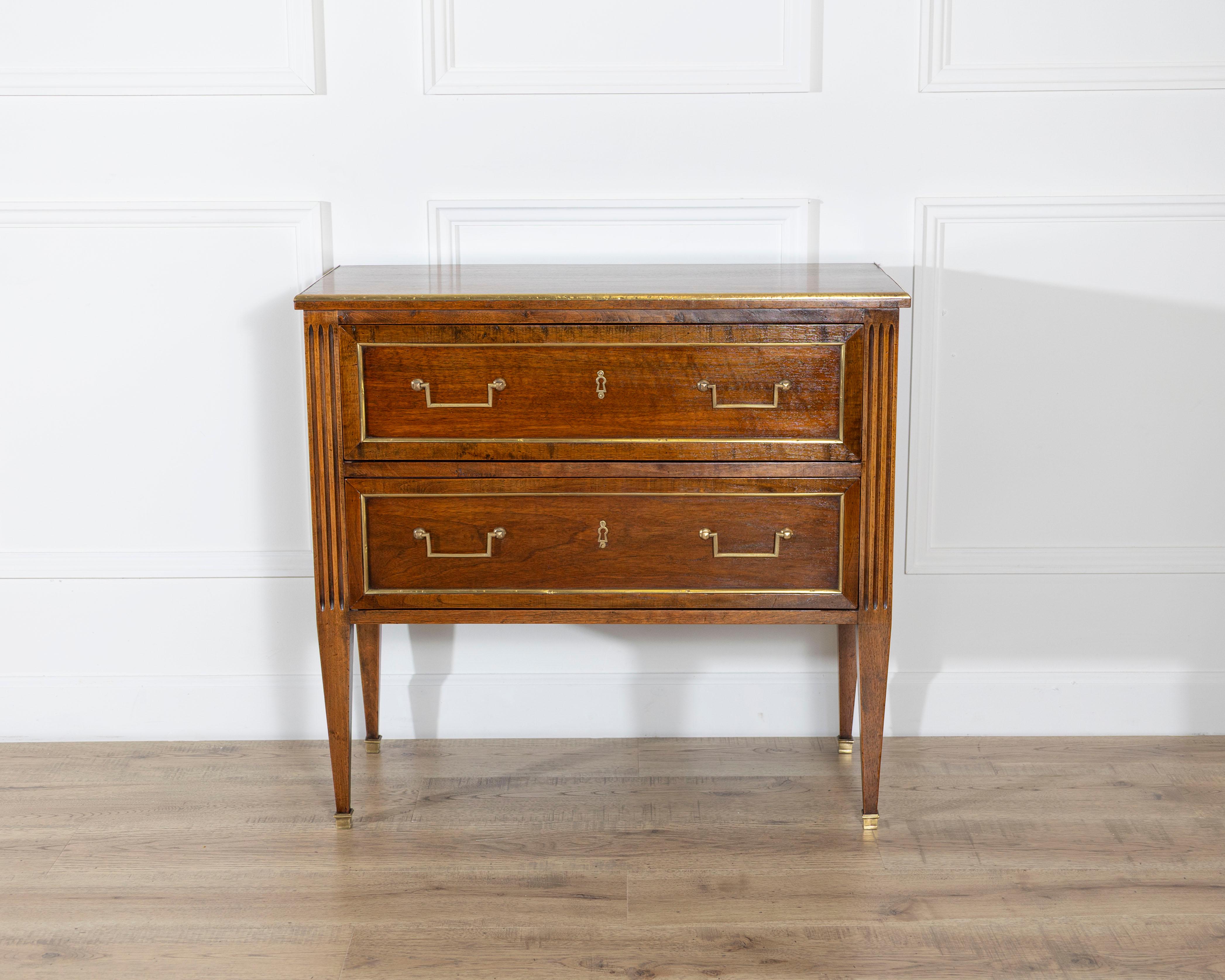This elegant Directoire period chest of drawers, crafted in France in the 19th century, reflects the refined neoclassical aesthetic of the late 18th and early 19th centuries. Constructed from richly grained mahogany with a warm, lustrous patina, it