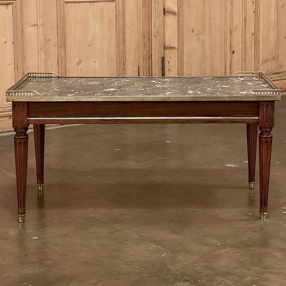 Antique Directoire style marble top coffee table represents the essence of understated elegance! Tailored classical architecture was employed to create the design, which was inspired by the bouillotte tables popular in the 18th and 19th centuries.