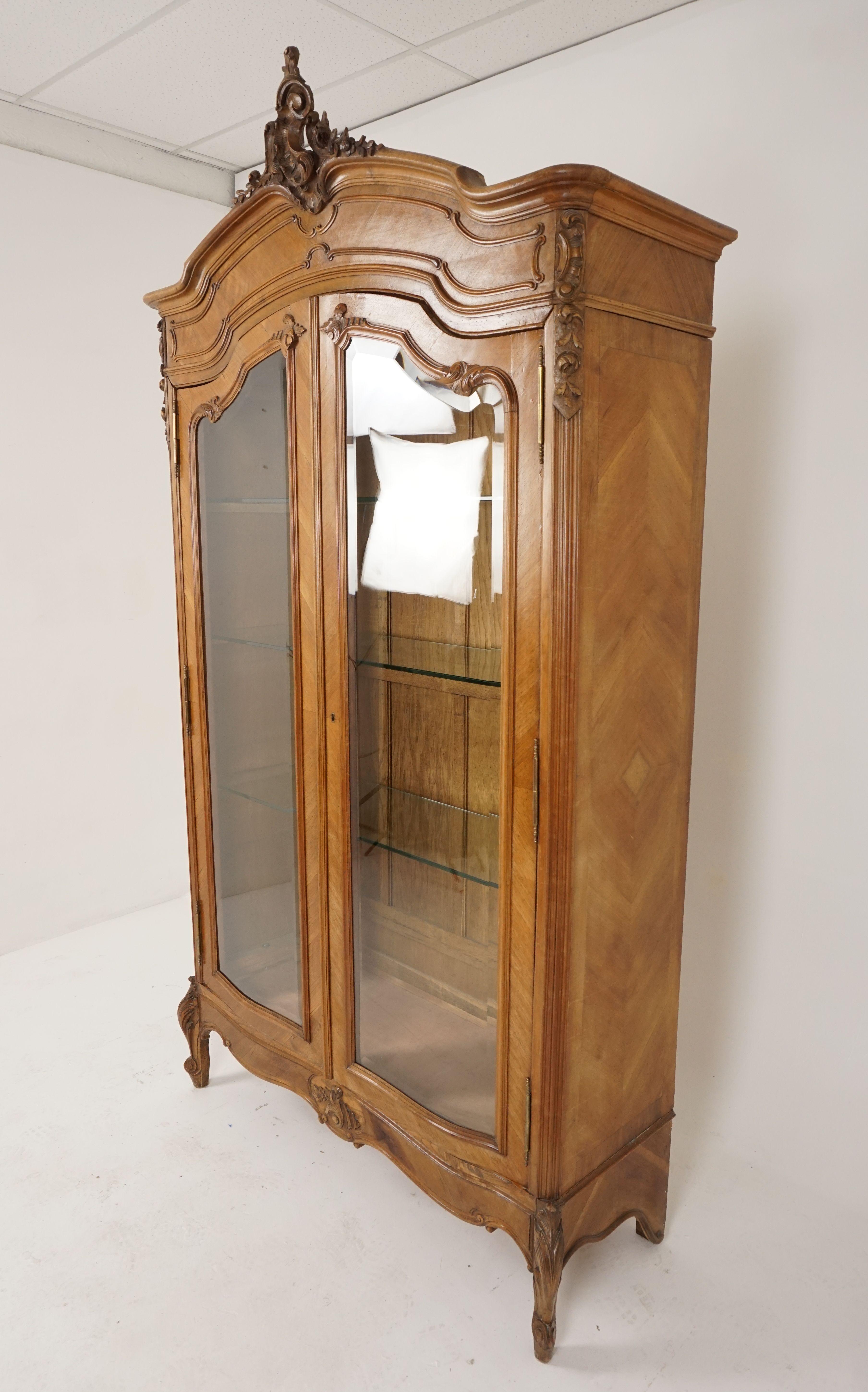 Antique display cabinet, 19th century, walnut, France 1880, B2567

France 1880
Solid walnut And veneers
Original finish 
Carved canopy with pierced carving depicting floral detailing and an acanthus leaf
Carved top and sides
Pair of shaped