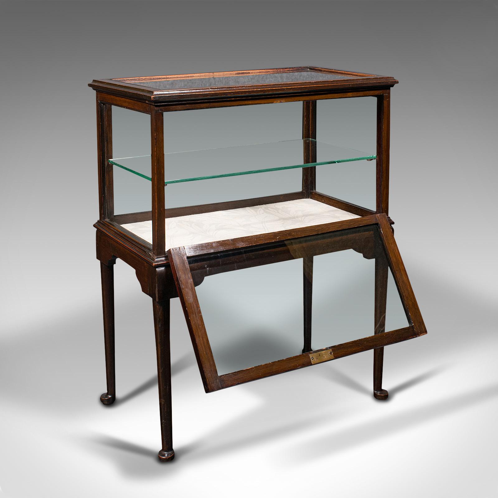 This is an antique display case. An English, mahogany bijouterie table, dating to the Edwardian period, circa 1910.

Pleasingly bright display cabinet, ideal for central room placement
Displaying a desirable aged patina and in good order
Select