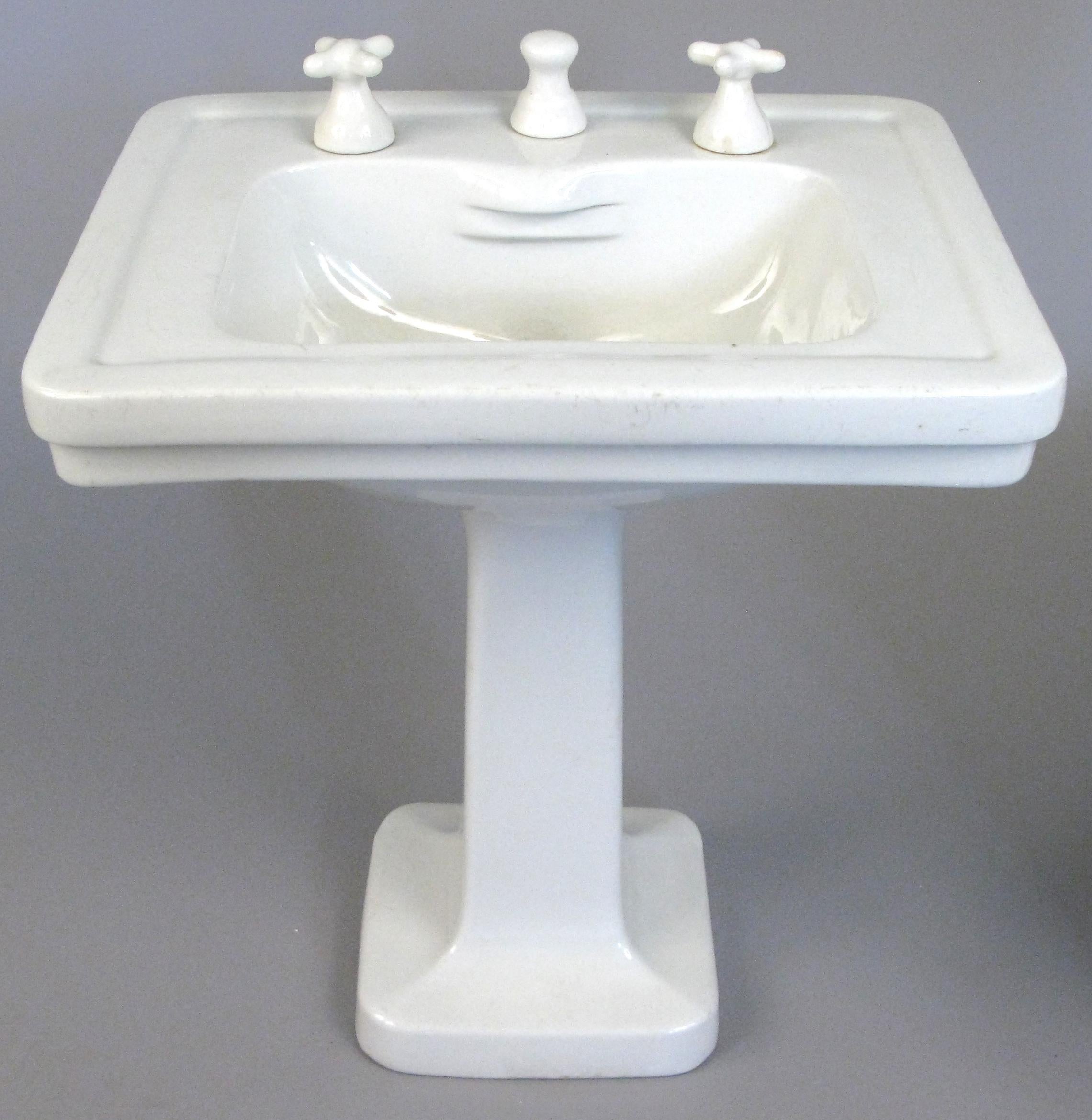 a charming and rare set of small scale antique porcelain display samples of a pedestal sink and companion soaking tub, by Maddocks Madbury. 

Sink dimensions: 15.5