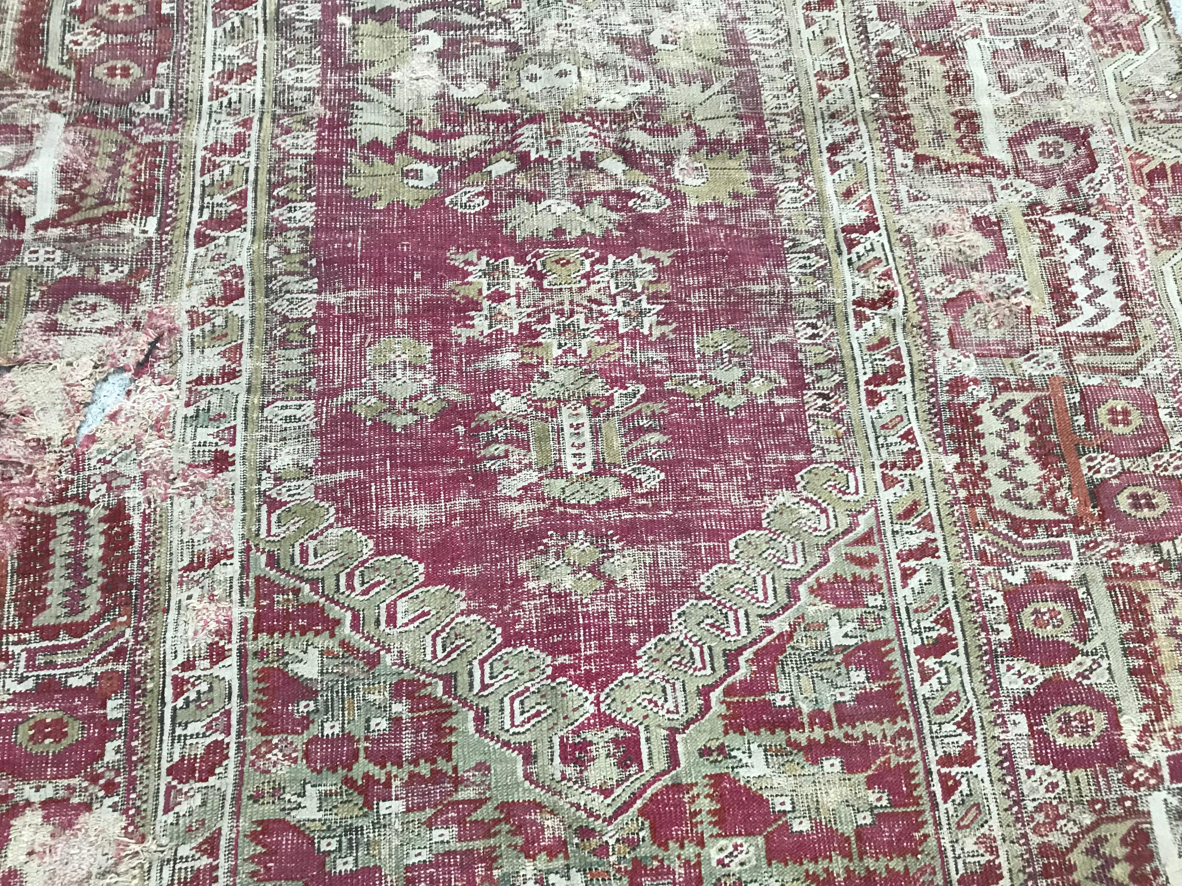 Hand-Knotted Antique Distressed 18th Century Turkish Ghyordes Rug