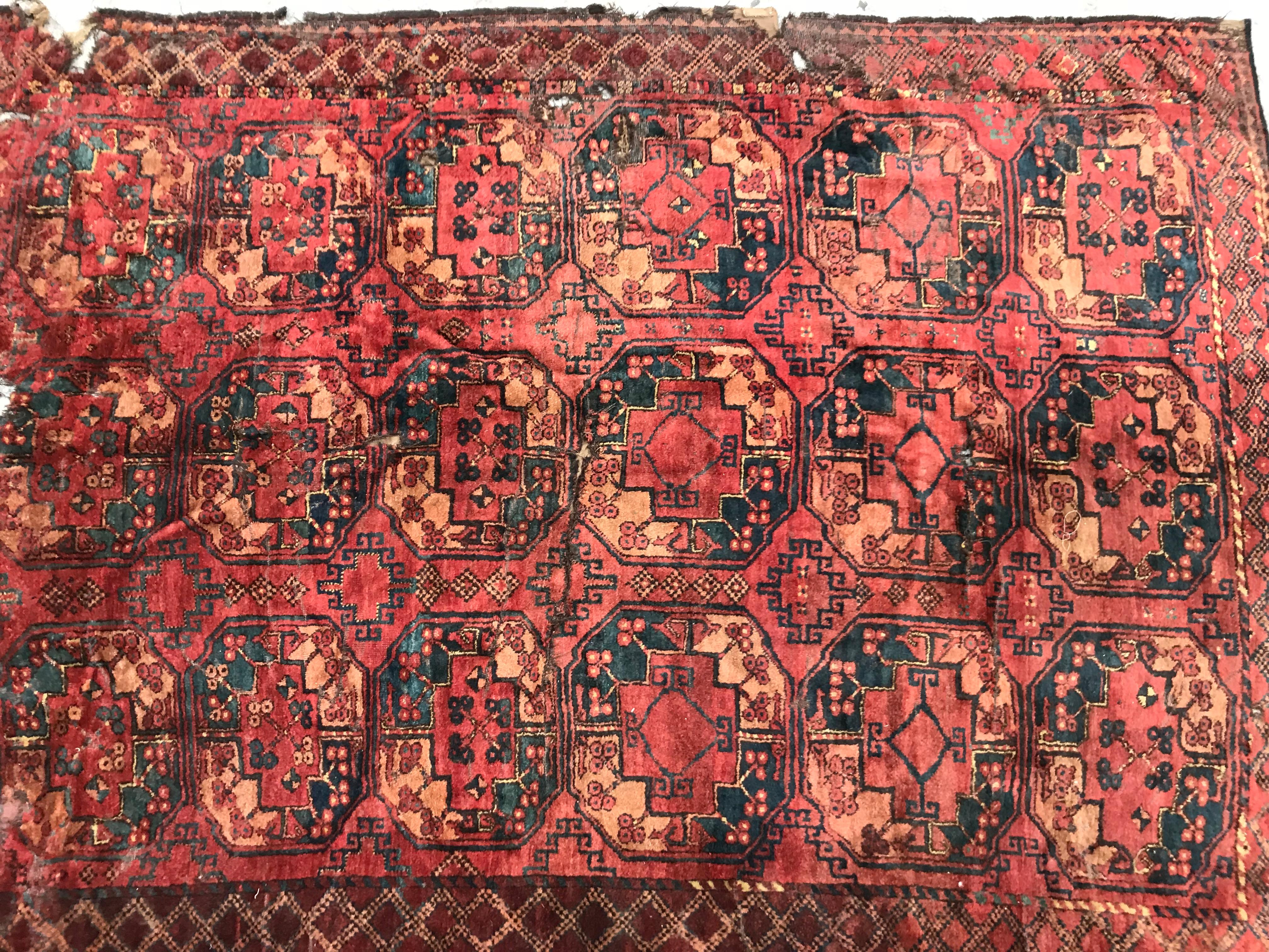 Beautiful 19th century distressed Turkmen Ersari rug, with a typical geometrical Turkmen Gul design and nice natural colors with red, orange, green, blue and purple, entirely hand knotted with wool velvet on wool foundation. Measures: 6ft 8in x 9ft