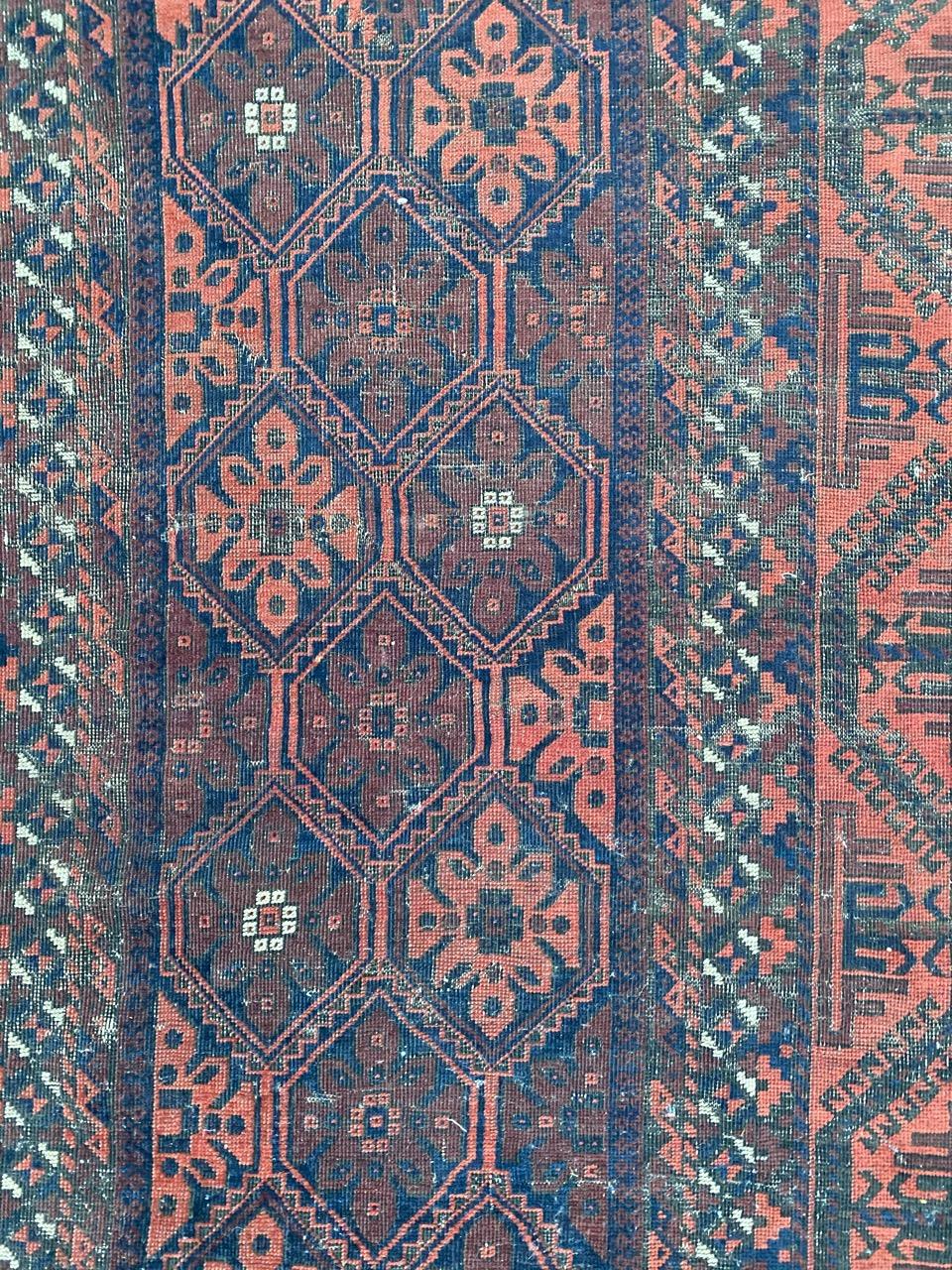 Wool Antique Distressed Baluch Afghan Rug For Sale