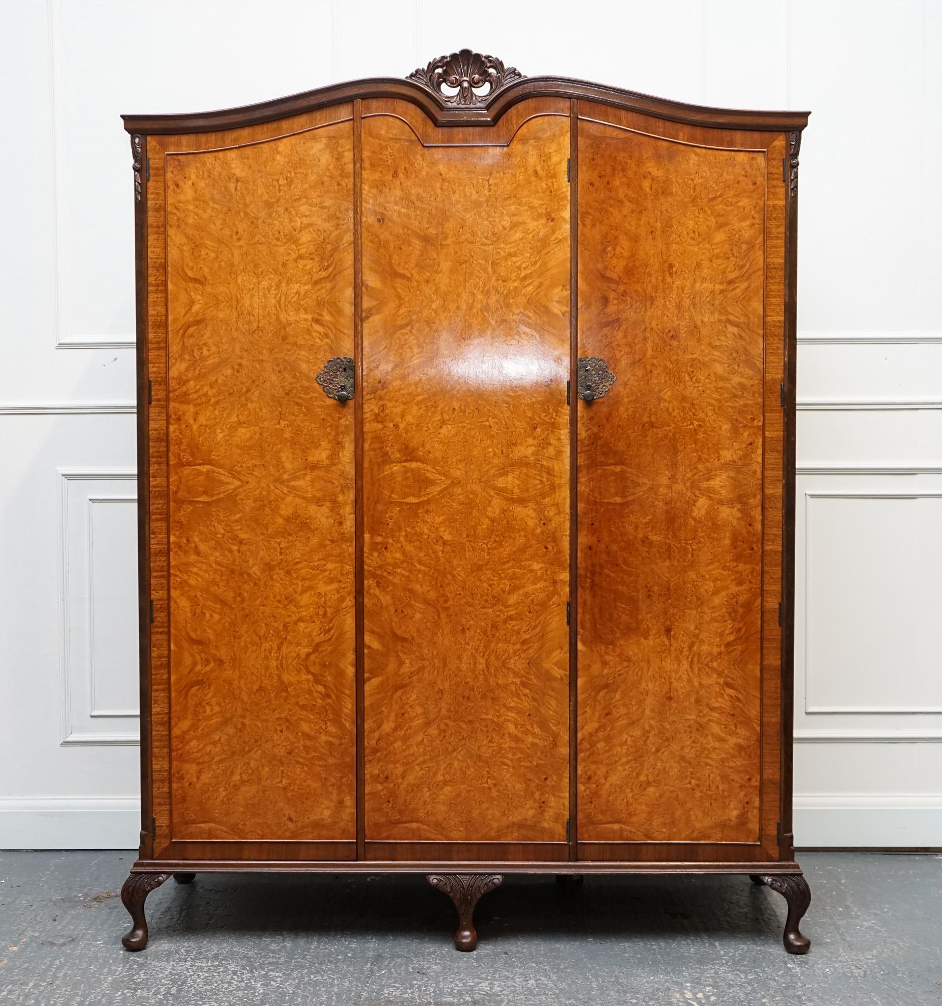 
We are delighted to offer for sale this Gorgeous Victoria Regina Distressed Art Deco Burr Walnut Triple Wardrobe.

The lock on the wardrobe engraved V.R which is Victoria Regina. 

A very solid and well made wardrobe, three of the doors have been