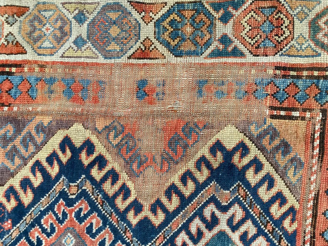 Hand-Knotted Antique Distressed Caucasian Kazak Rug