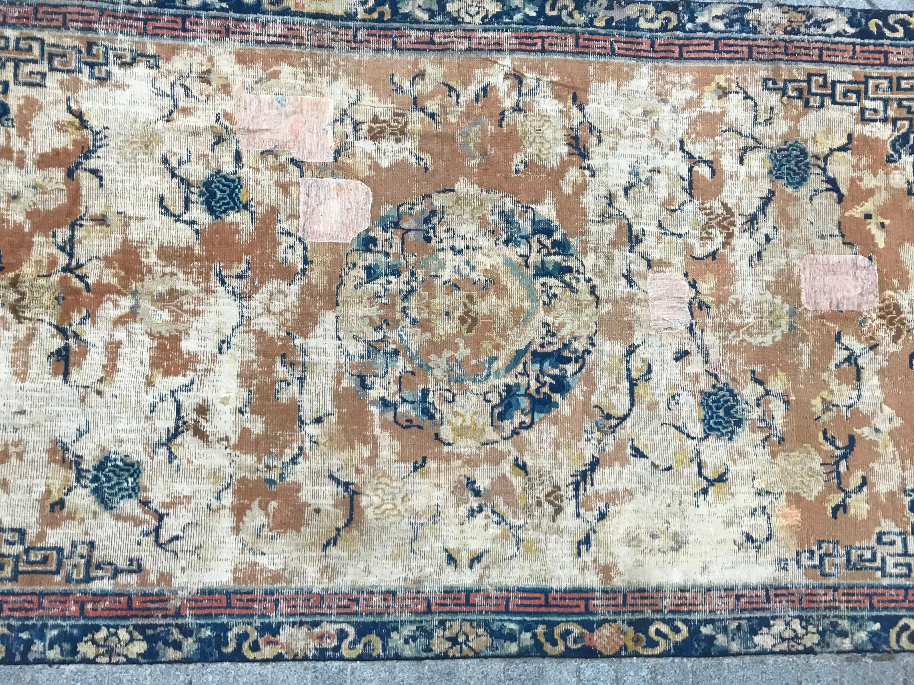 Large distressed antique Chinese rug probably, late 18th or early 19th century
Some old reparations, with nice Chinese design and beautiful colors with yellow and blue, entirely hand knotted with wool velvet on cotton foundation.