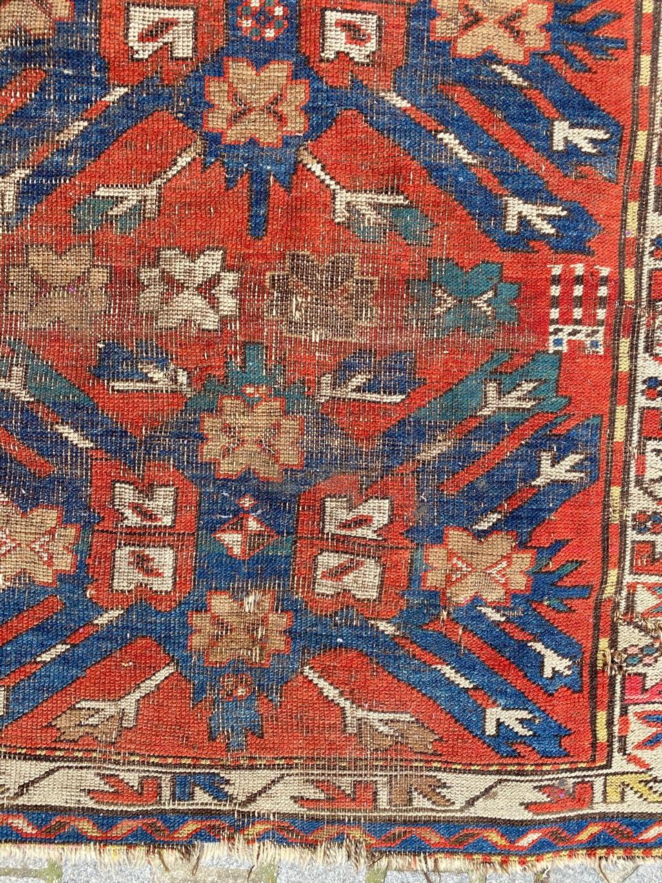 Late 19th century Kazak rug with an eagle design and blue, red, yellow and green natural colors, entirely hand knotted with wool velvet on wool foundation.