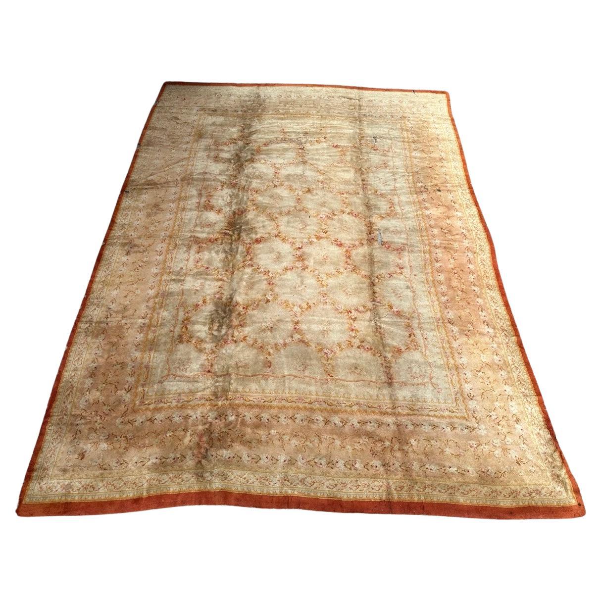 Antique distressed french savonnerie design carpet