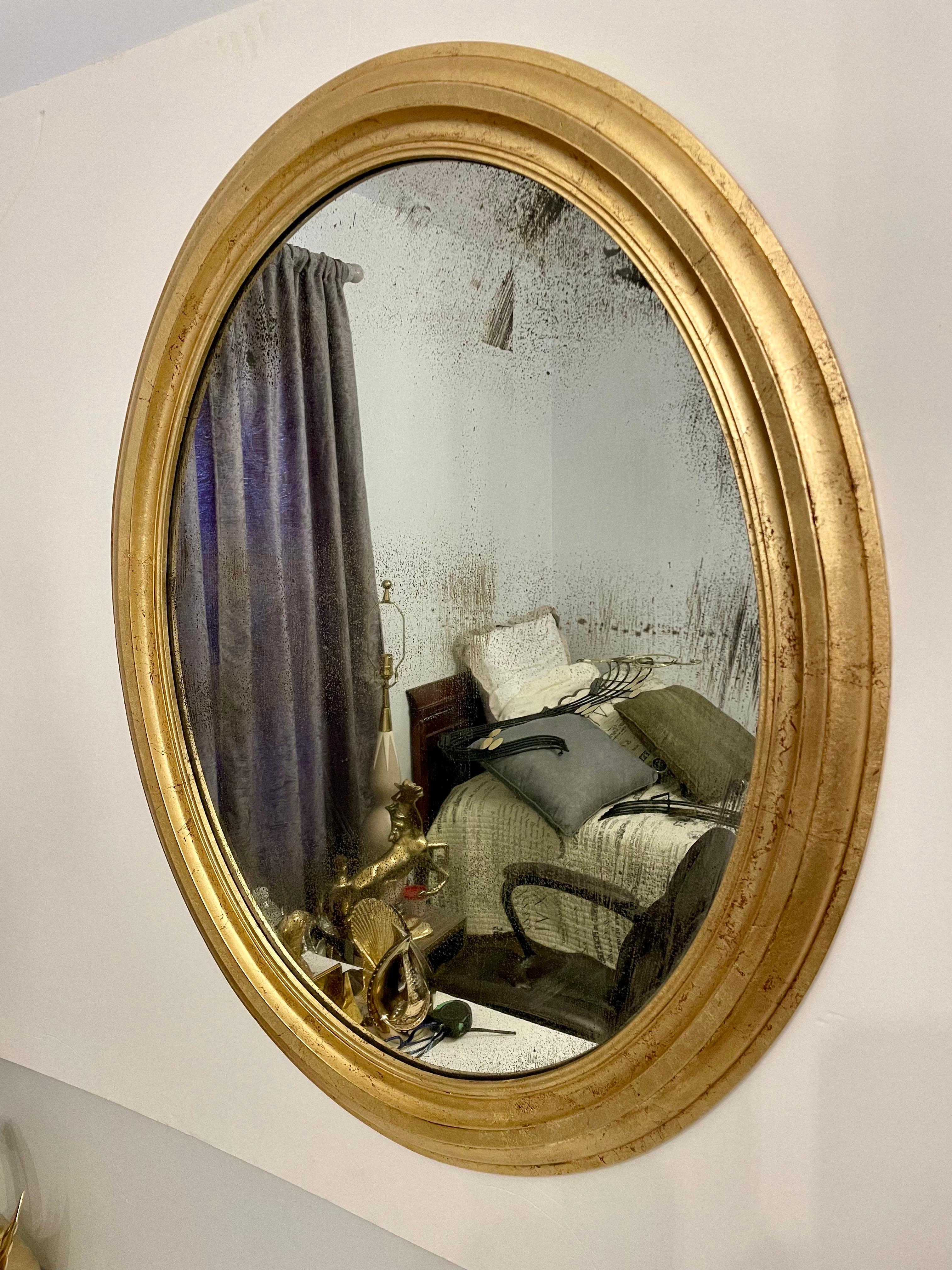 Antique Distressed Gold Gilt Oval Mirror. Good overall condition, few rubs and wear to finish from age and use as shown in photos. Mirror glass is well distressed from age and use.  Ready to hang and use with wire on back. Tri State area delivery