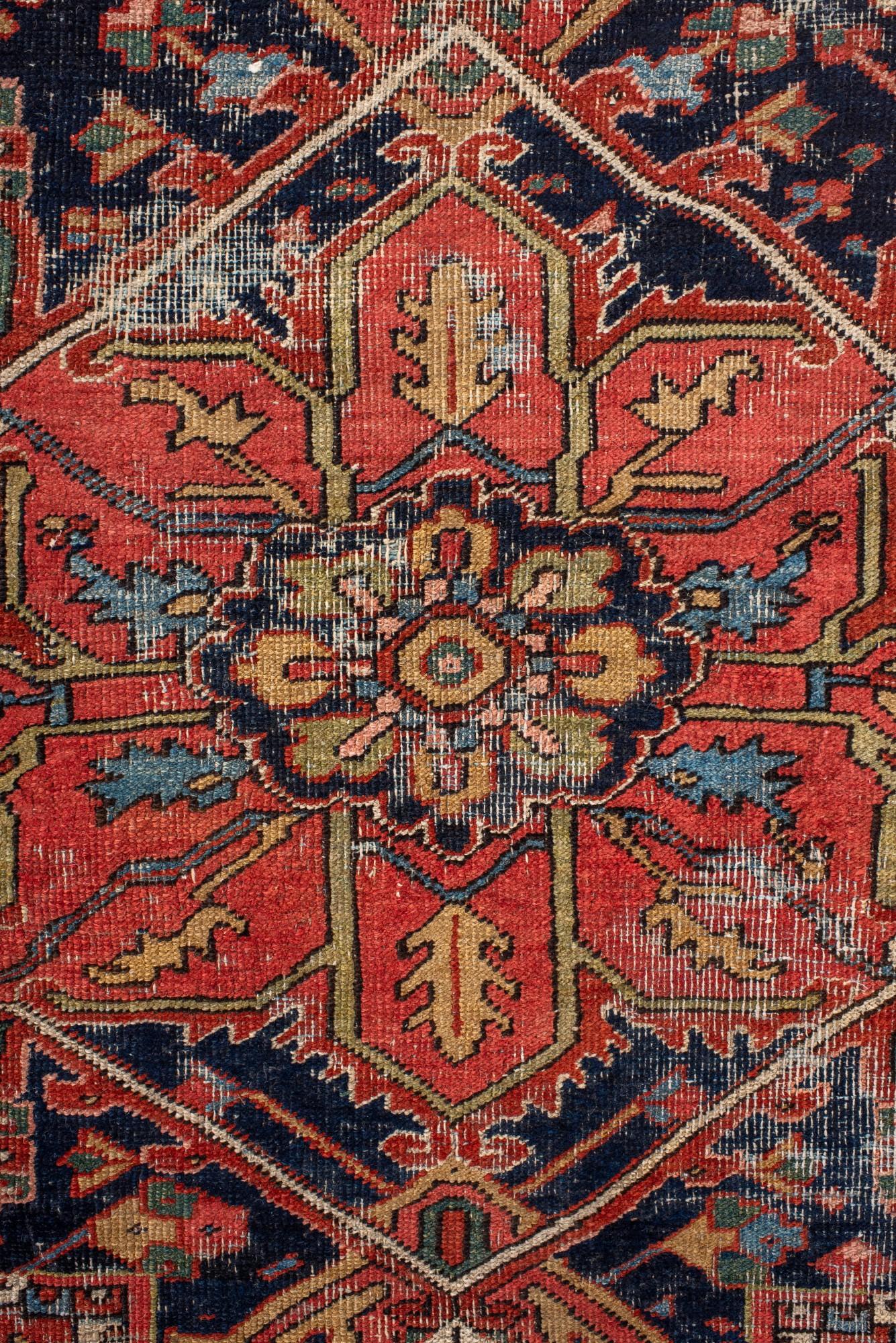 Hand-Knotted Antique Distressed Heriz Rug with Bold Medallion For Sale