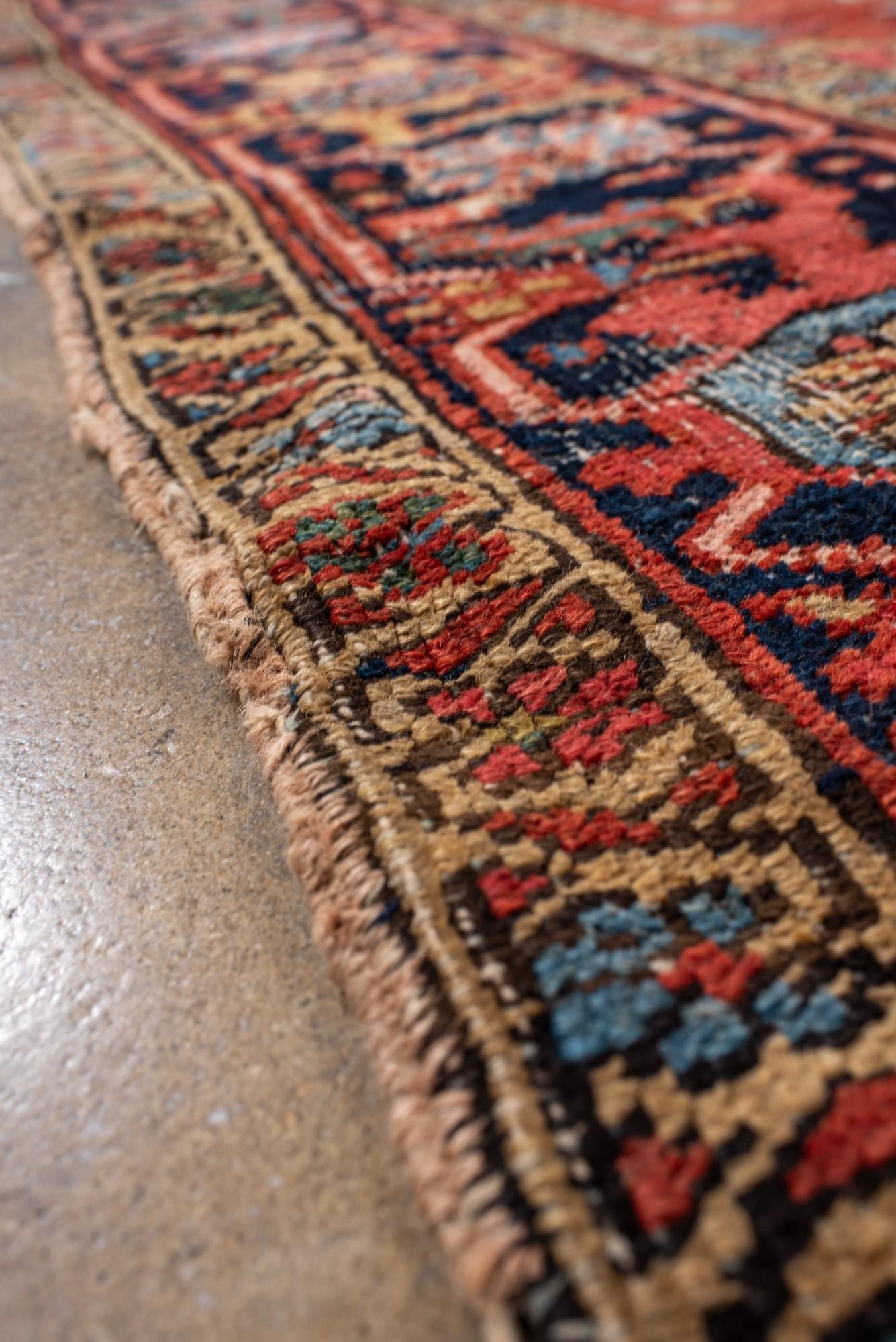 Wool Antique Distressed Heriz Rug with Bold Medallion For Sale