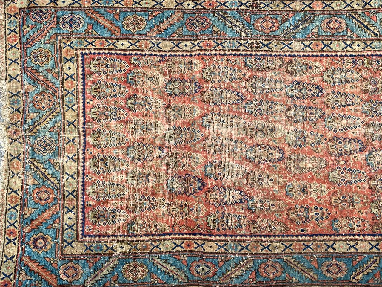 Beautiful antique distressed Heriz runner with nice Botteh and stylized design and beautiful natural colors, entirely hand knotted with wool velvet on cotton foundation.