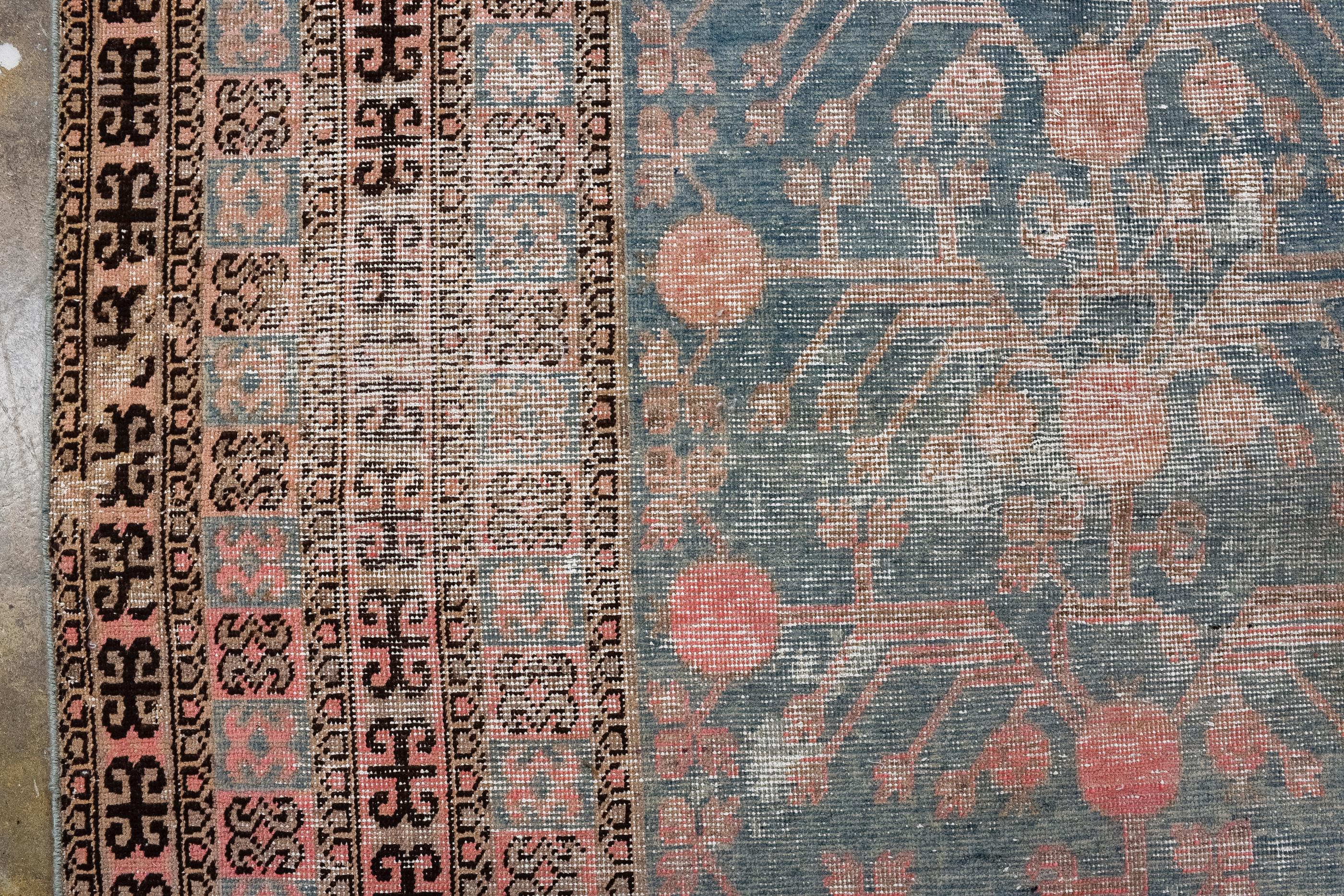 Antique Distressed Khotan Rug with Pomegranate Trees  In Good Condition For Sale In New York, NY