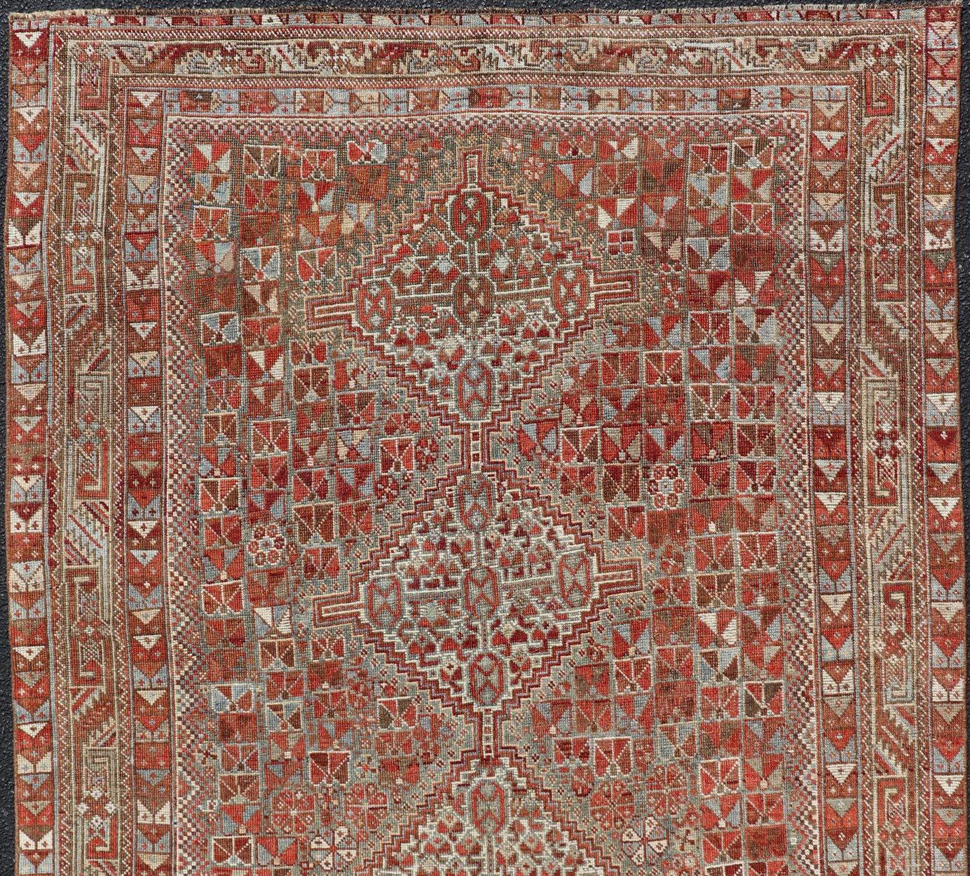 Tribal Antique Distressed Persian Medallion Shiraz Rug in Shades Rusty Red & Steel Blue For Sale