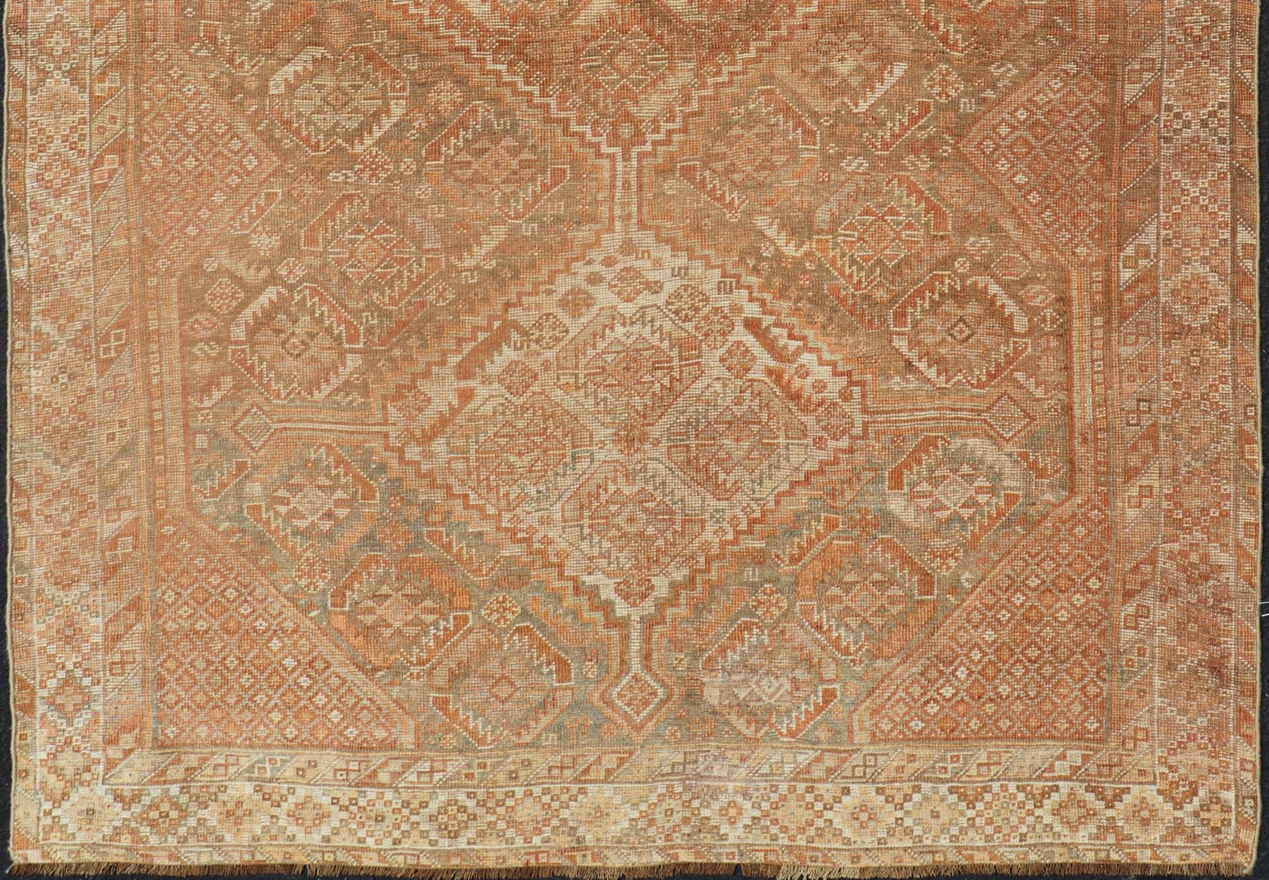 Tribal Antique Distressed Persian Shiraz Rug in Shades of Soft Orange, Lt. Brown, Gray For Sale
