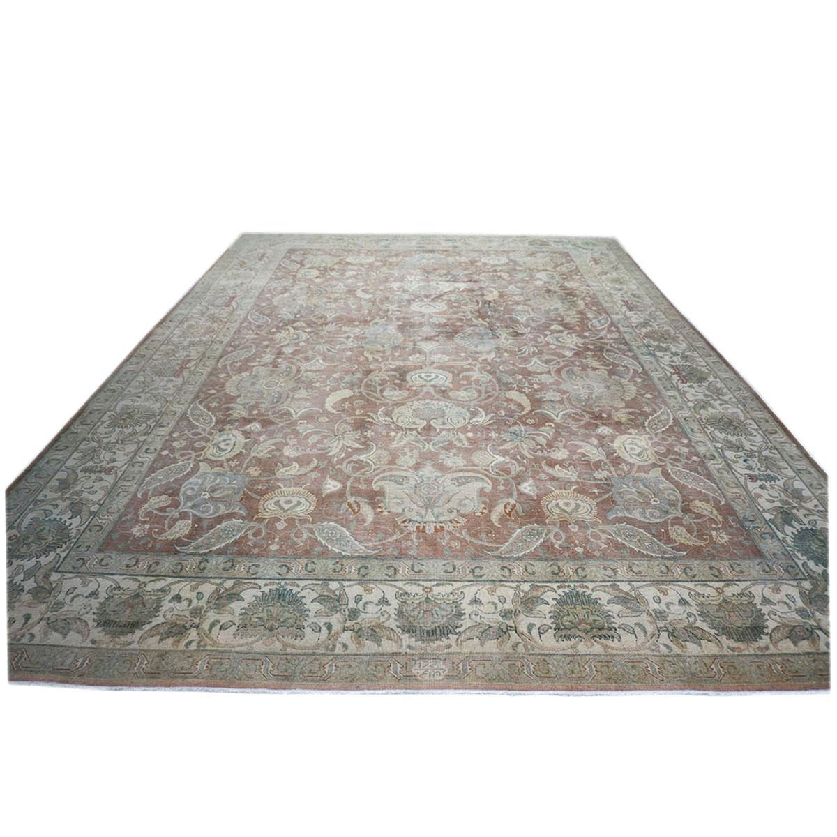 Ashly Fine Rugs presents a 1910 Antique Distressed Persian Tabriz 10 x 14 brown, green, and ivory handmade area rug. Tabriz is a northern city in modern-day Iran and has forever been famous for the fineness of its handmade rugs. This rug has a