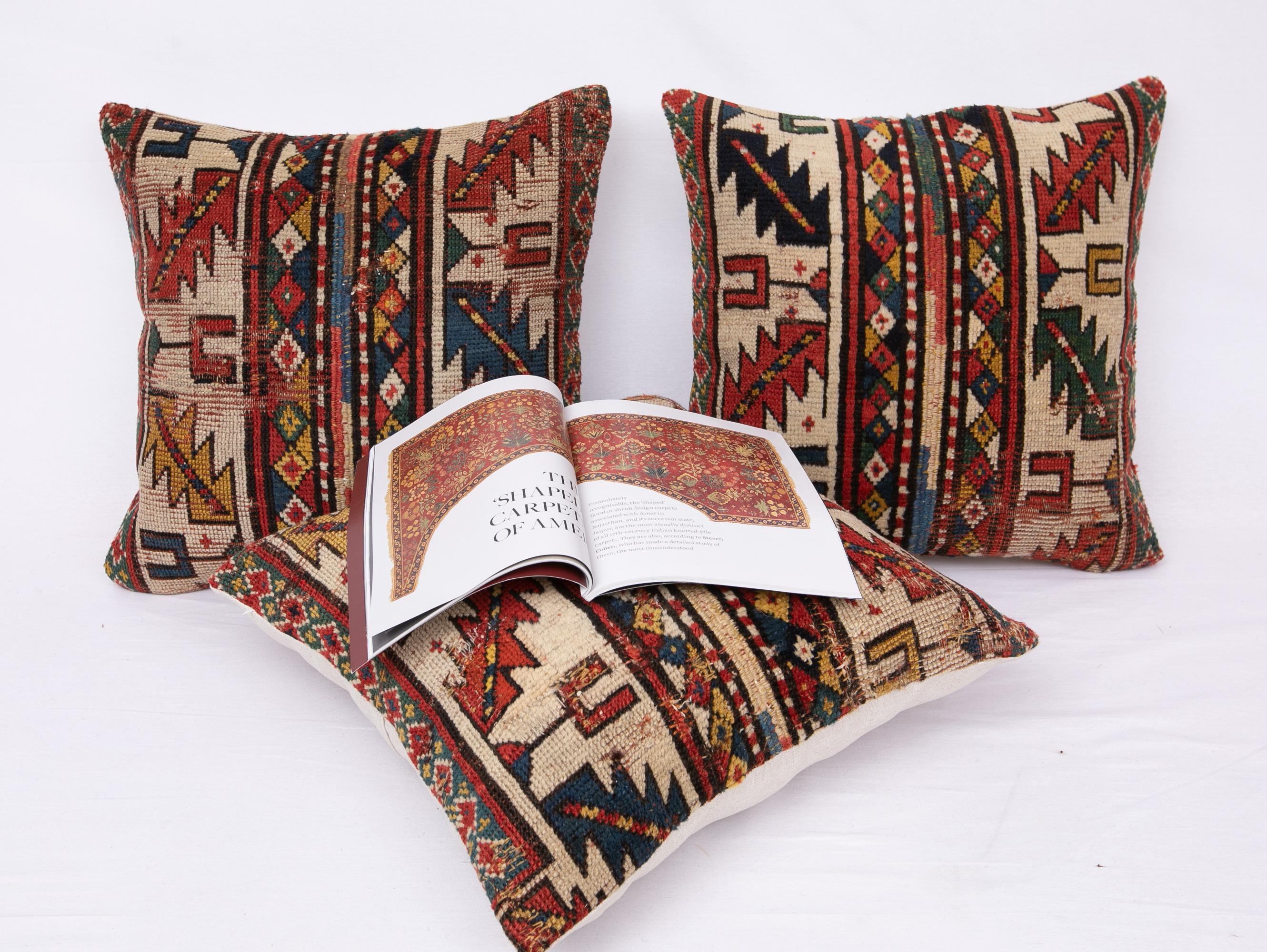 Tribal Antique Distressed Rug Pillow Covers Made from a 19th C Caucasian Rug a Set of 3 For Sale