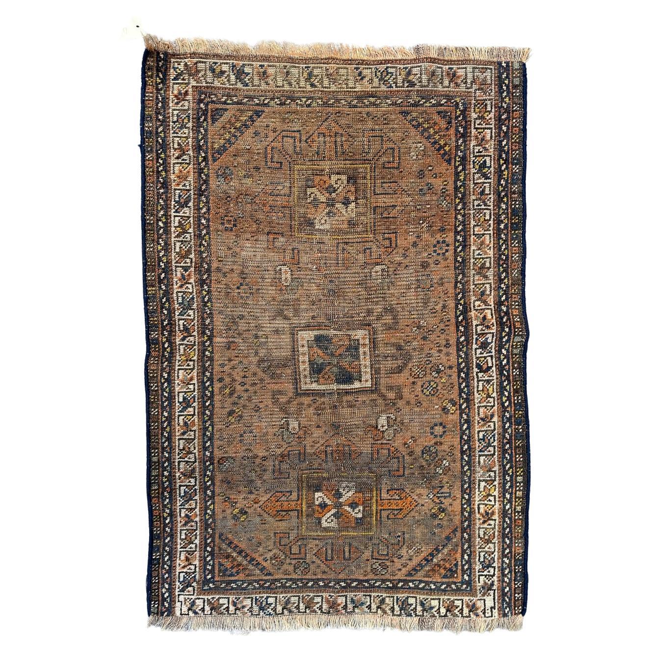 Antique distressed Shiraz rug